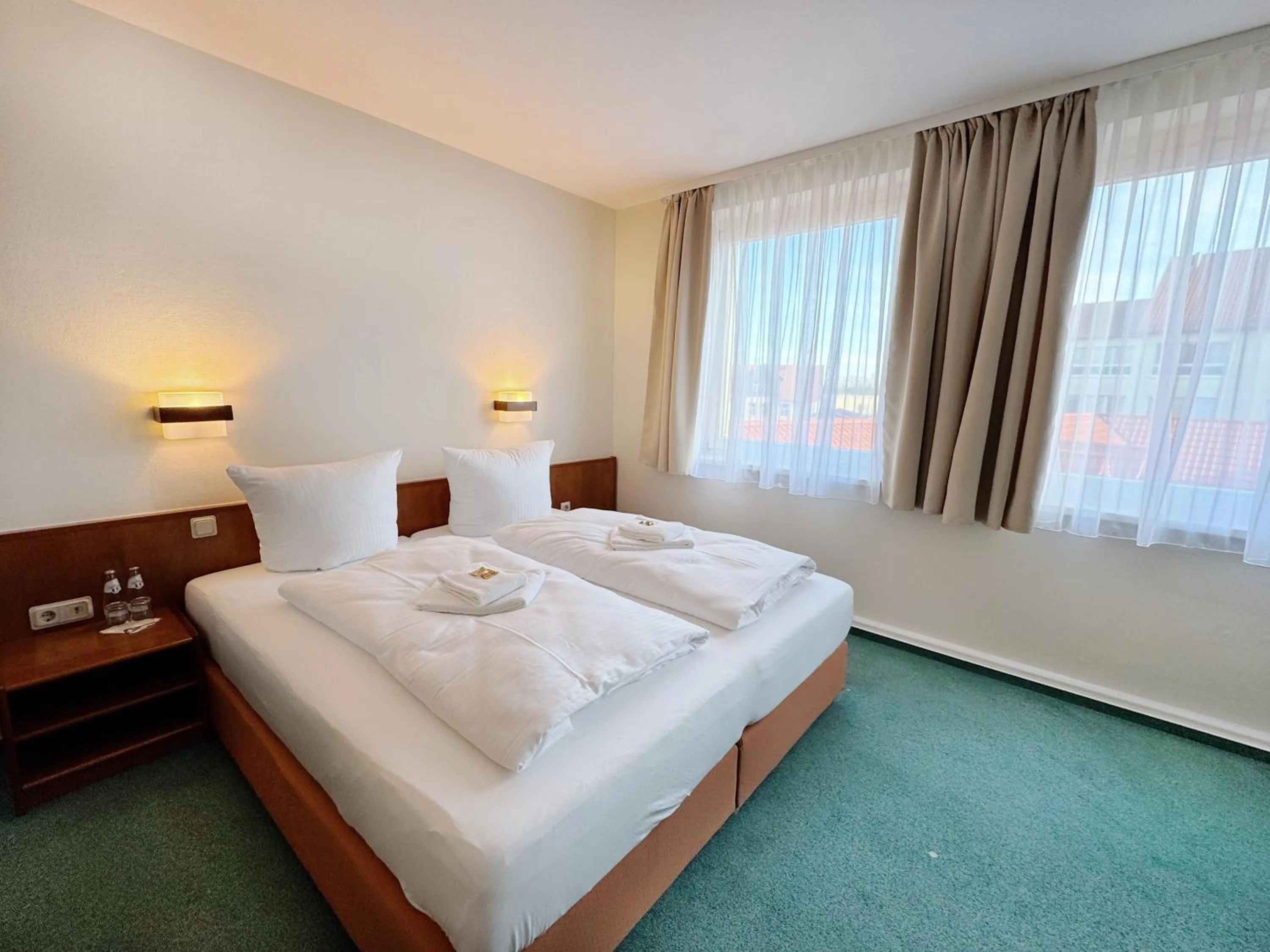 Bed in REGIOHOTEL Bunte Stadt Wernigerode - #DirektInDerAltstadt #PrimaFrühstück #TopPreisLeistung #FrischRenoviert
