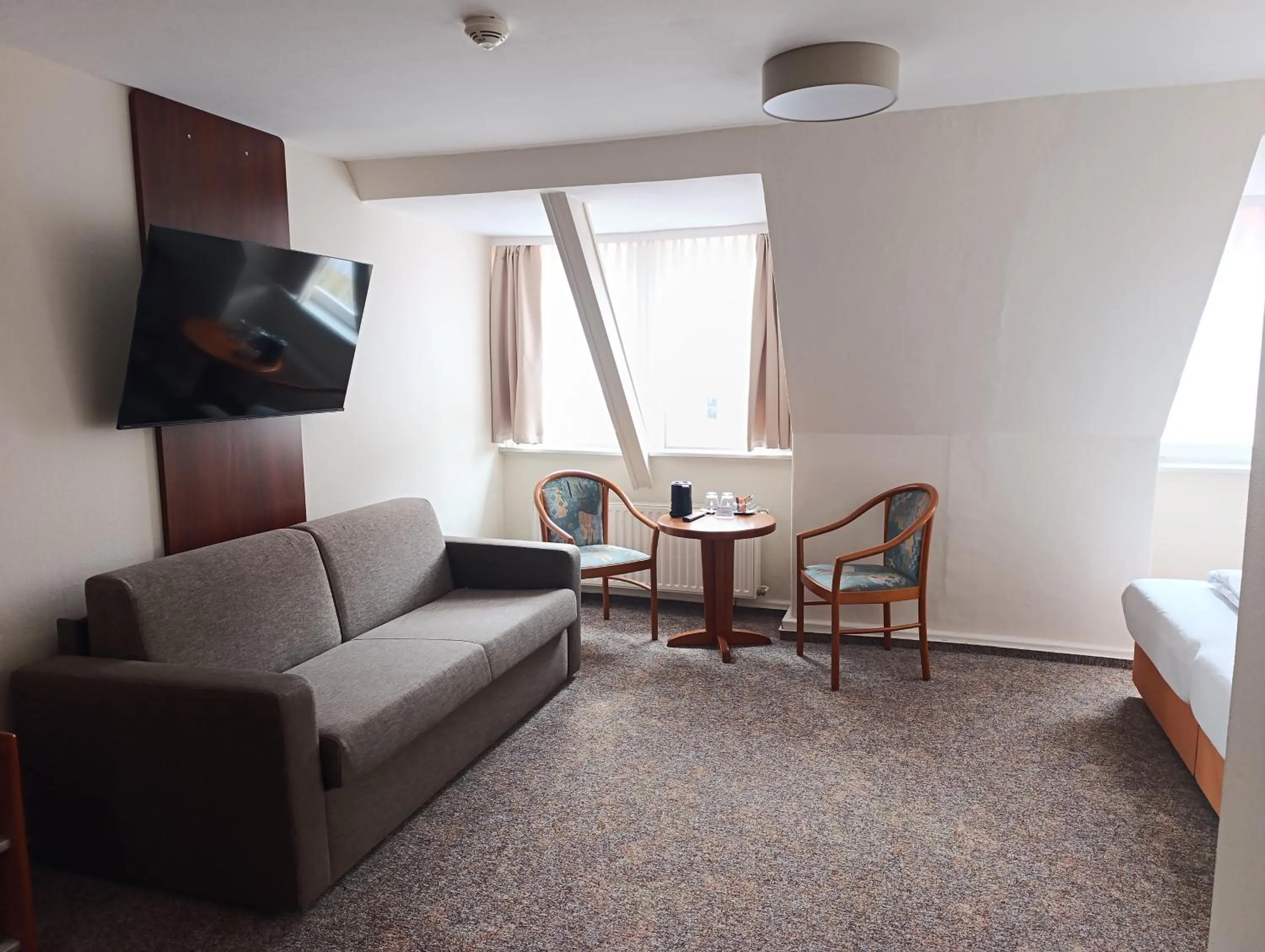 Seating area in REGIOHOTEL Bunte Stadt Wernigerode - #DirektInDerAltstadt #PrimaFrühstück #TopPreisLeistung #FrischRenoviert