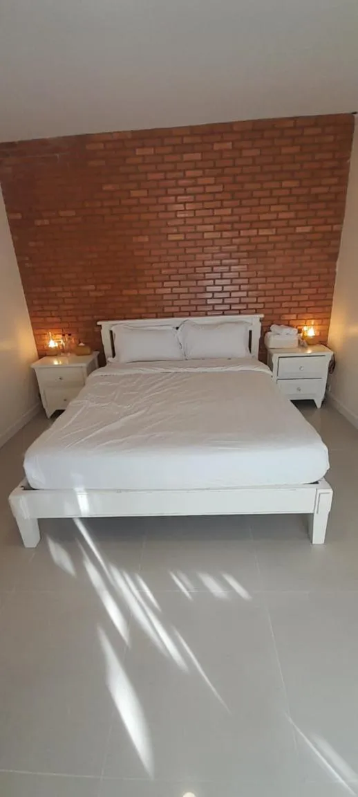 Bed in To The Moon Guesthouse