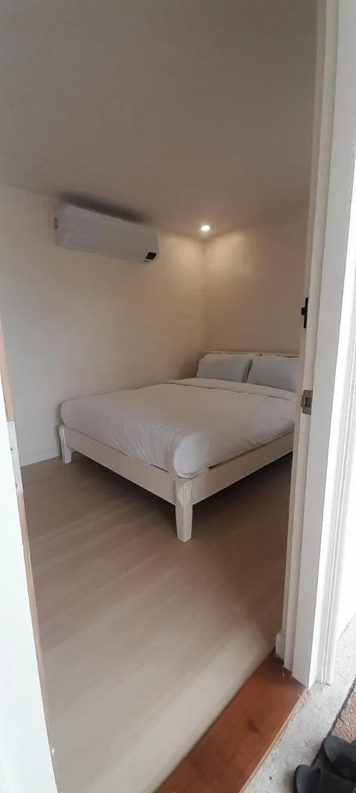 Bed in To The Moon Guesthouse