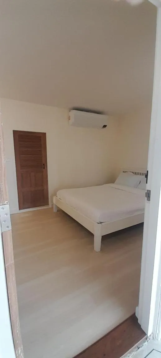 Bed in To The Moon Guesthouse