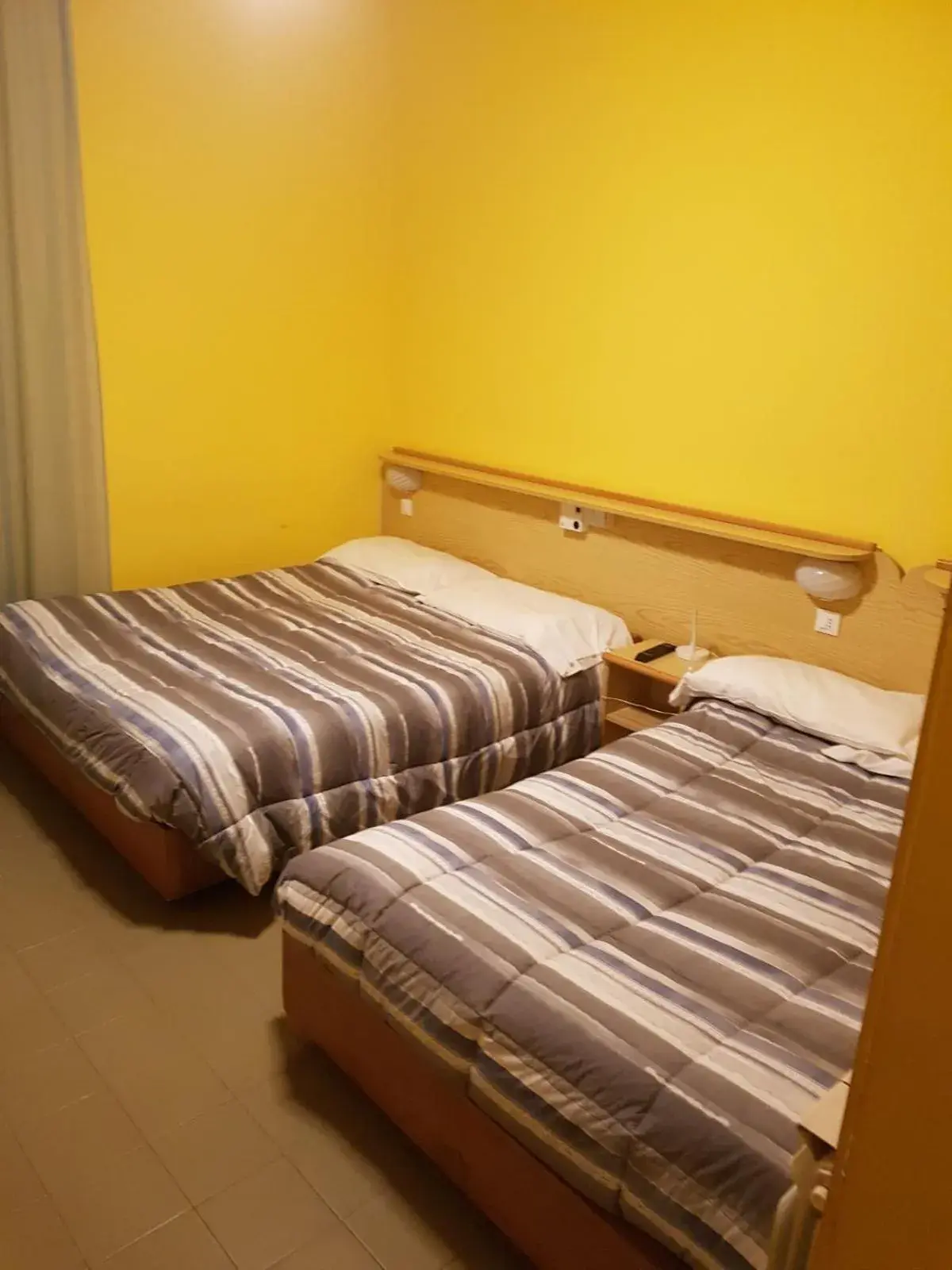 Economy Quadruple Room in Hotel Puntabella Economy Quadruple Room in Hotel Puntabella