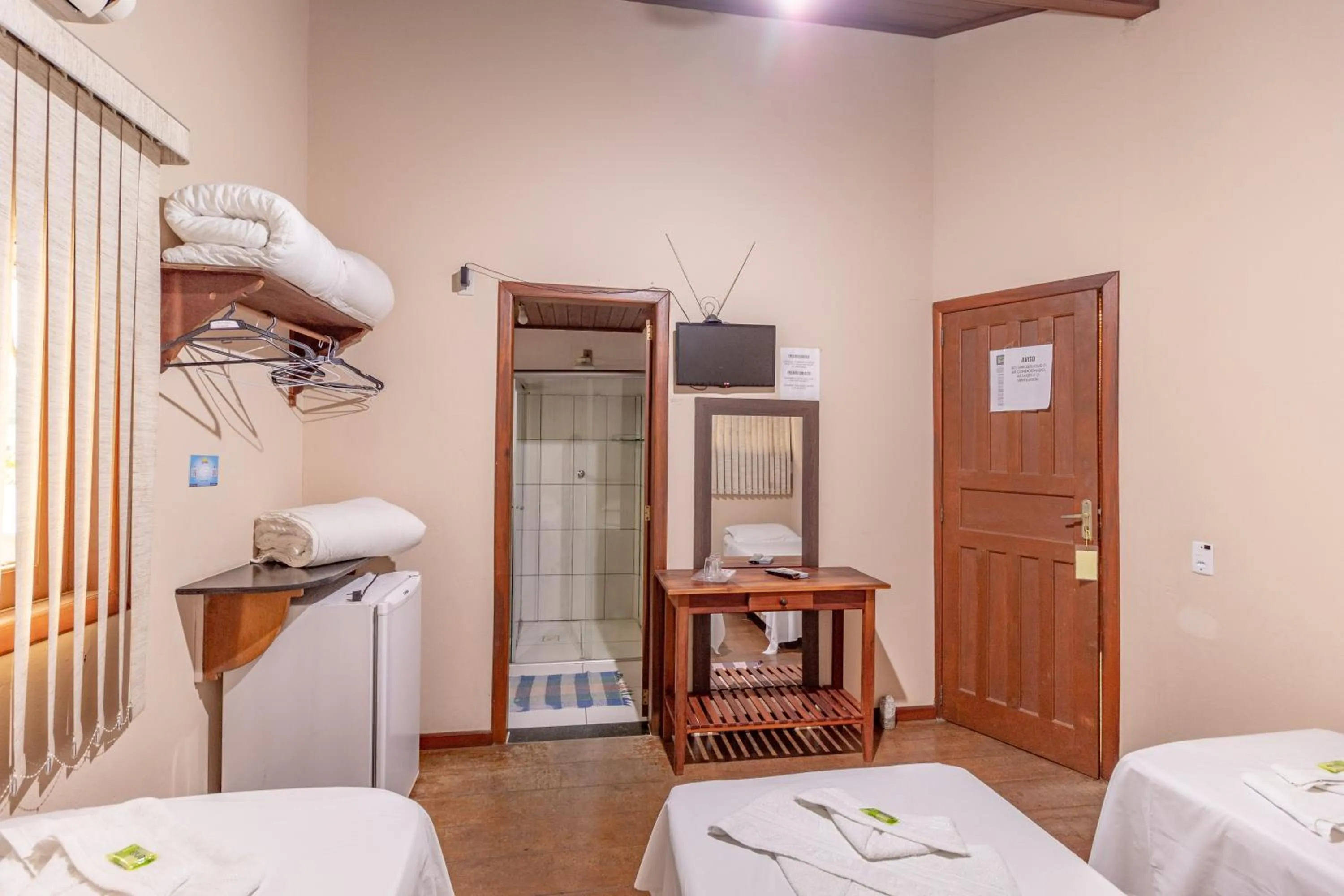 Bed in Pousada Luz do Sol