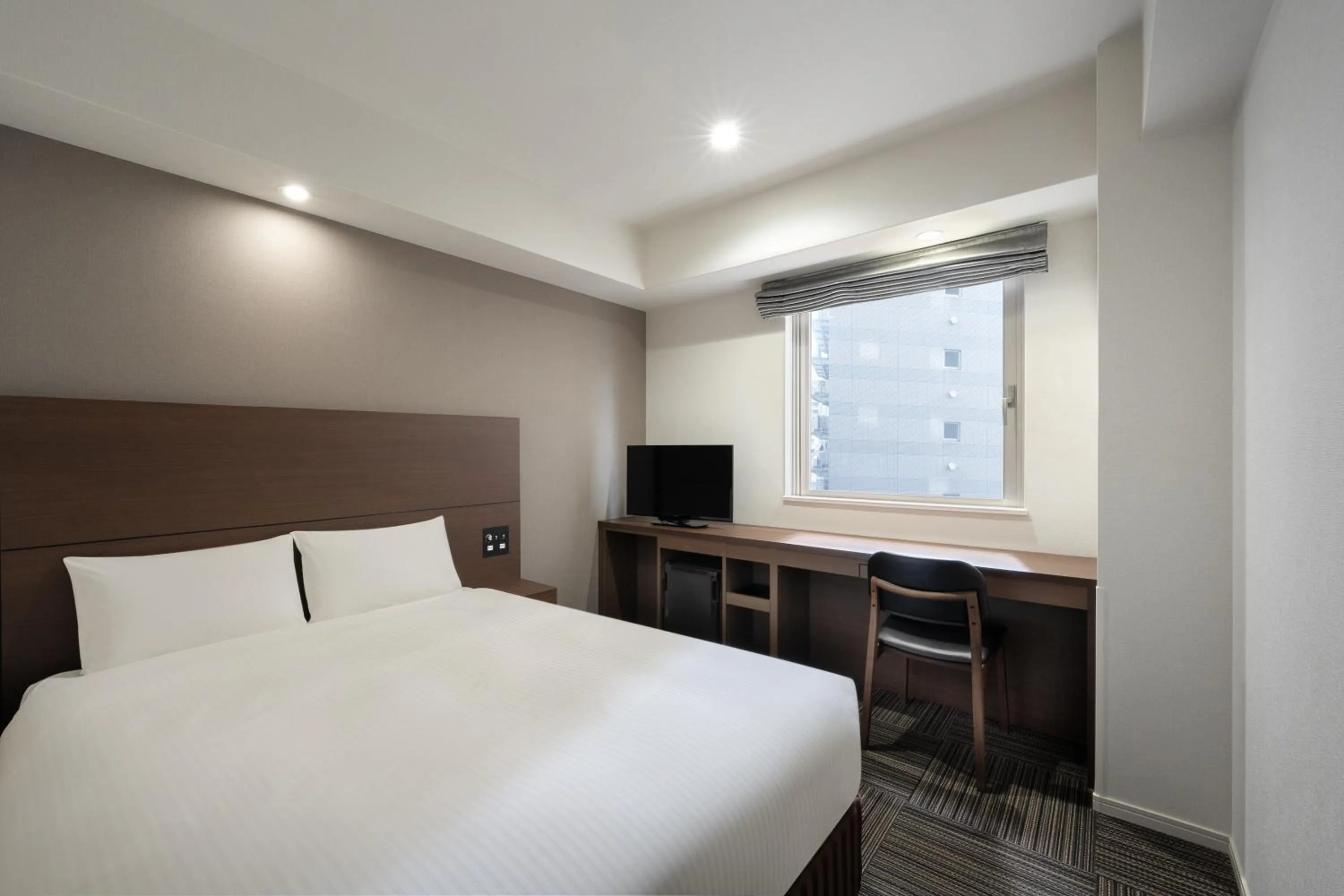 Bed in Hotel Oriental Express Kagoshima Tenmonkan