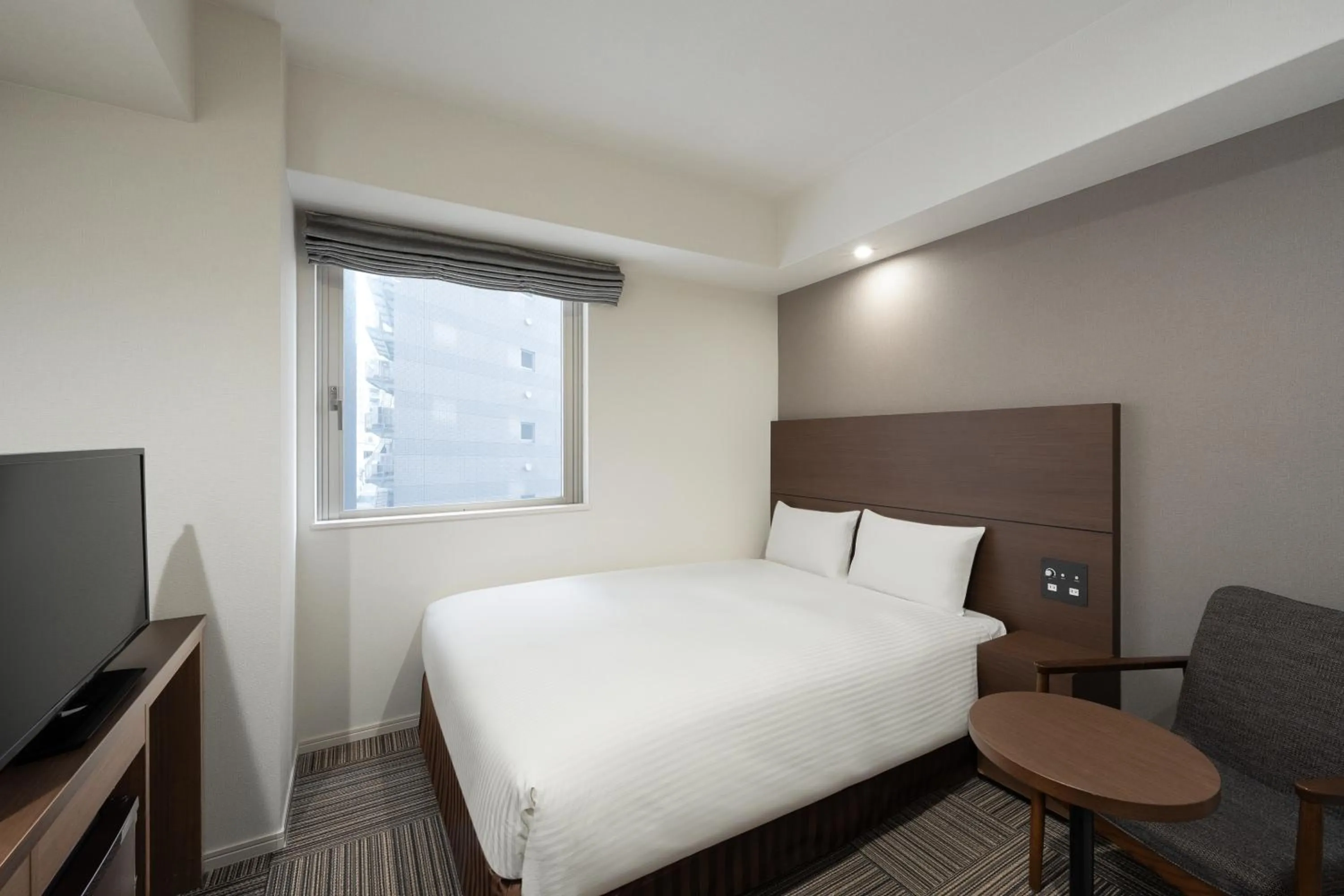 Bed in Hotel Oriental Express Kagoshima Tenmonkan