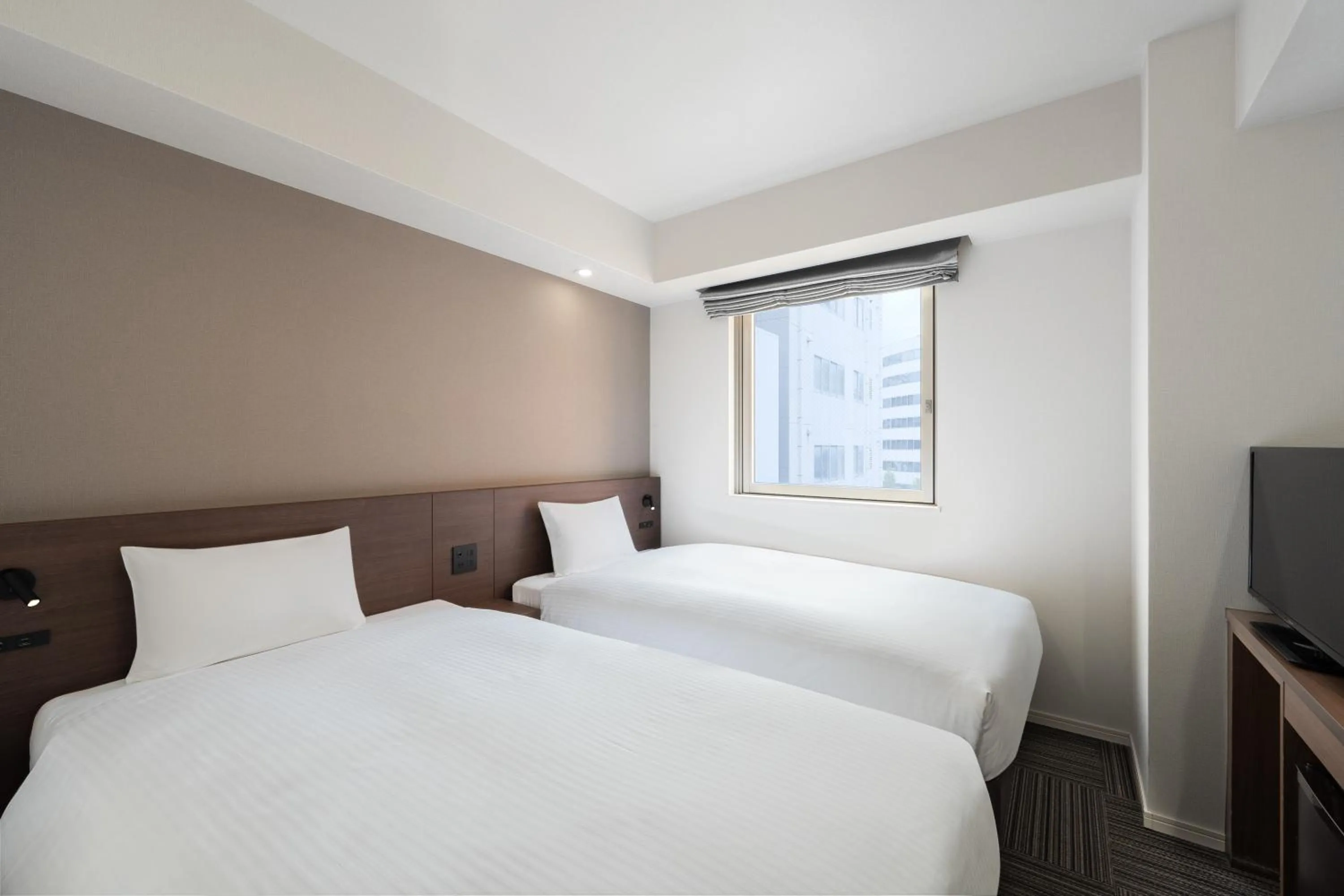 Bed in Hotel Oriental Express Kagoshima Tenmonkan