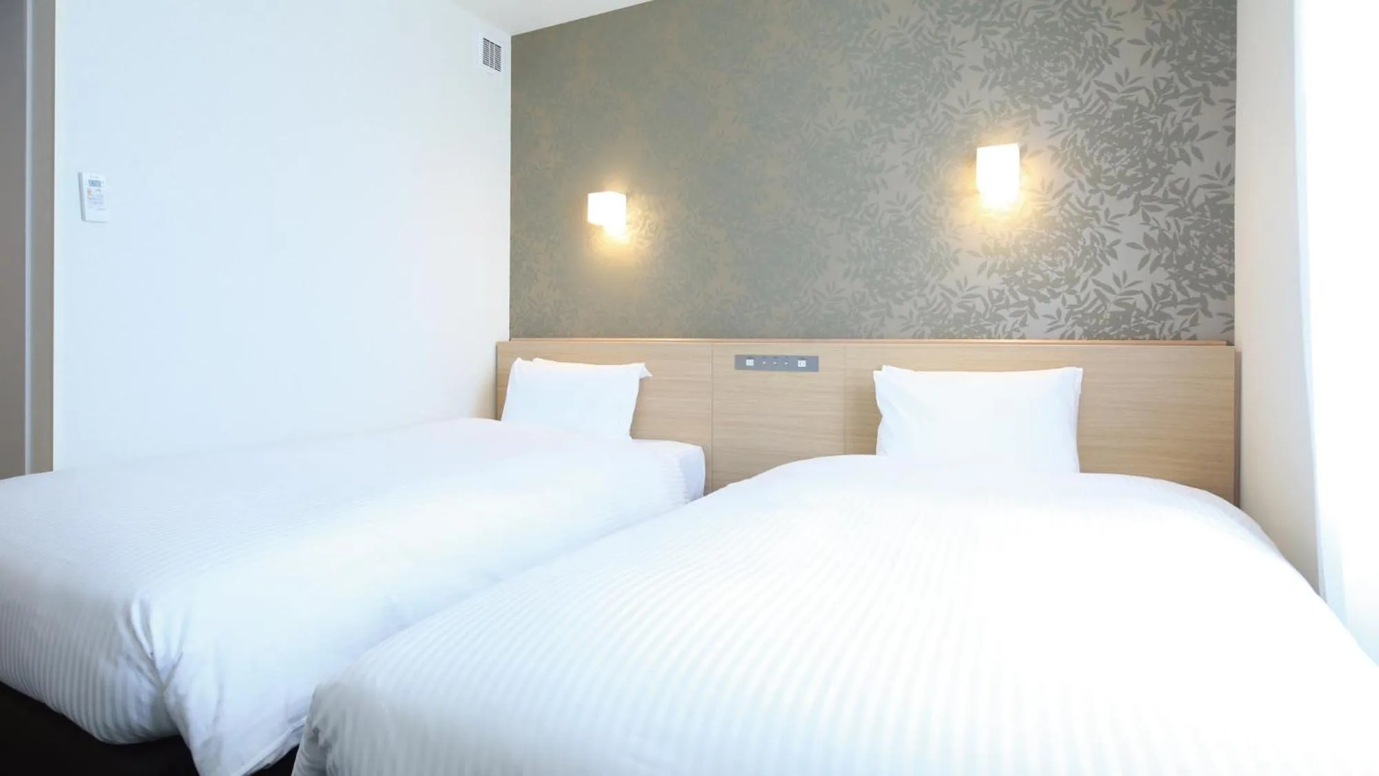 Bed in AB Hotel Sakaihigashi