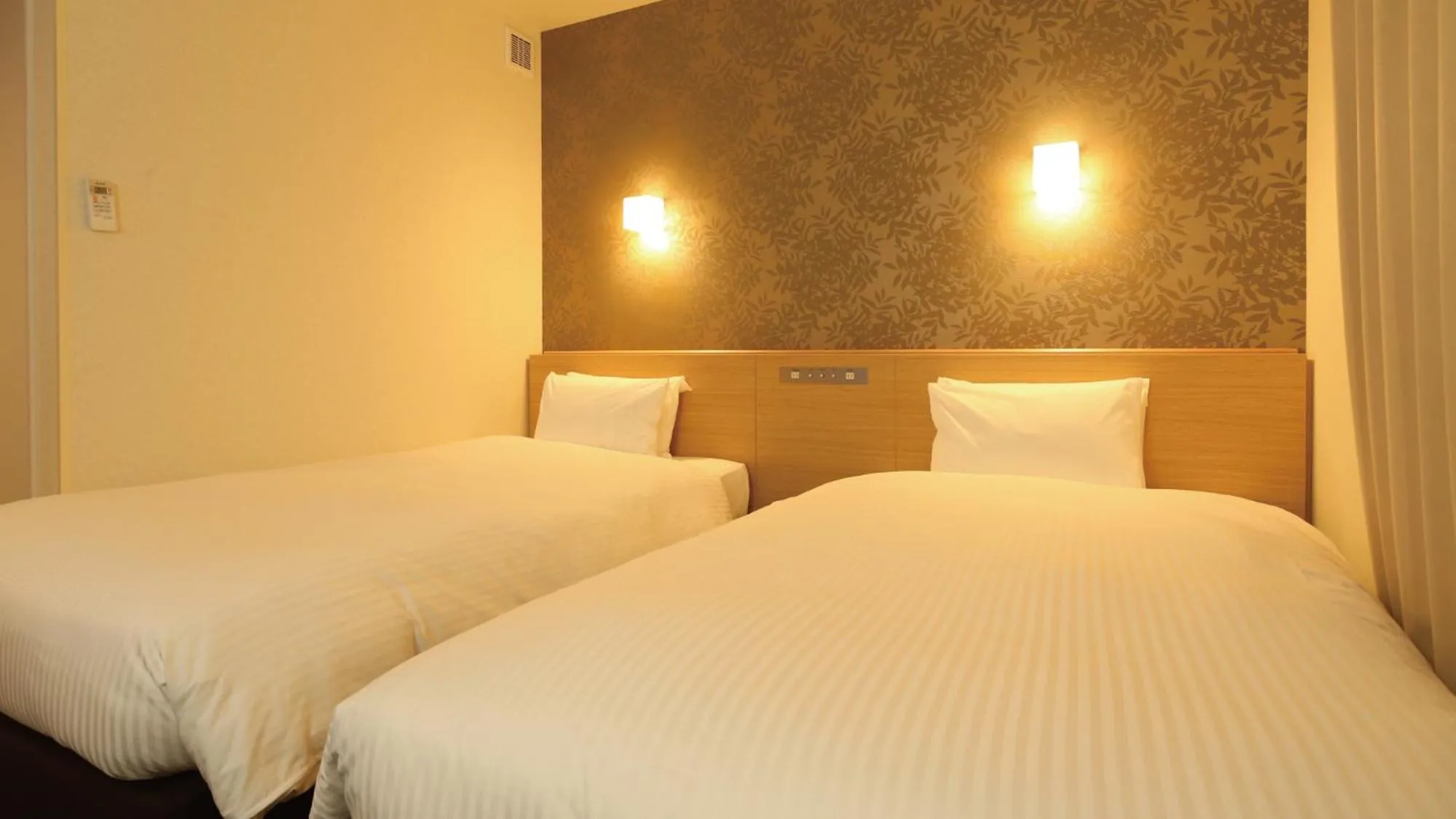 Bed in AB Hotel Sakaihigashi