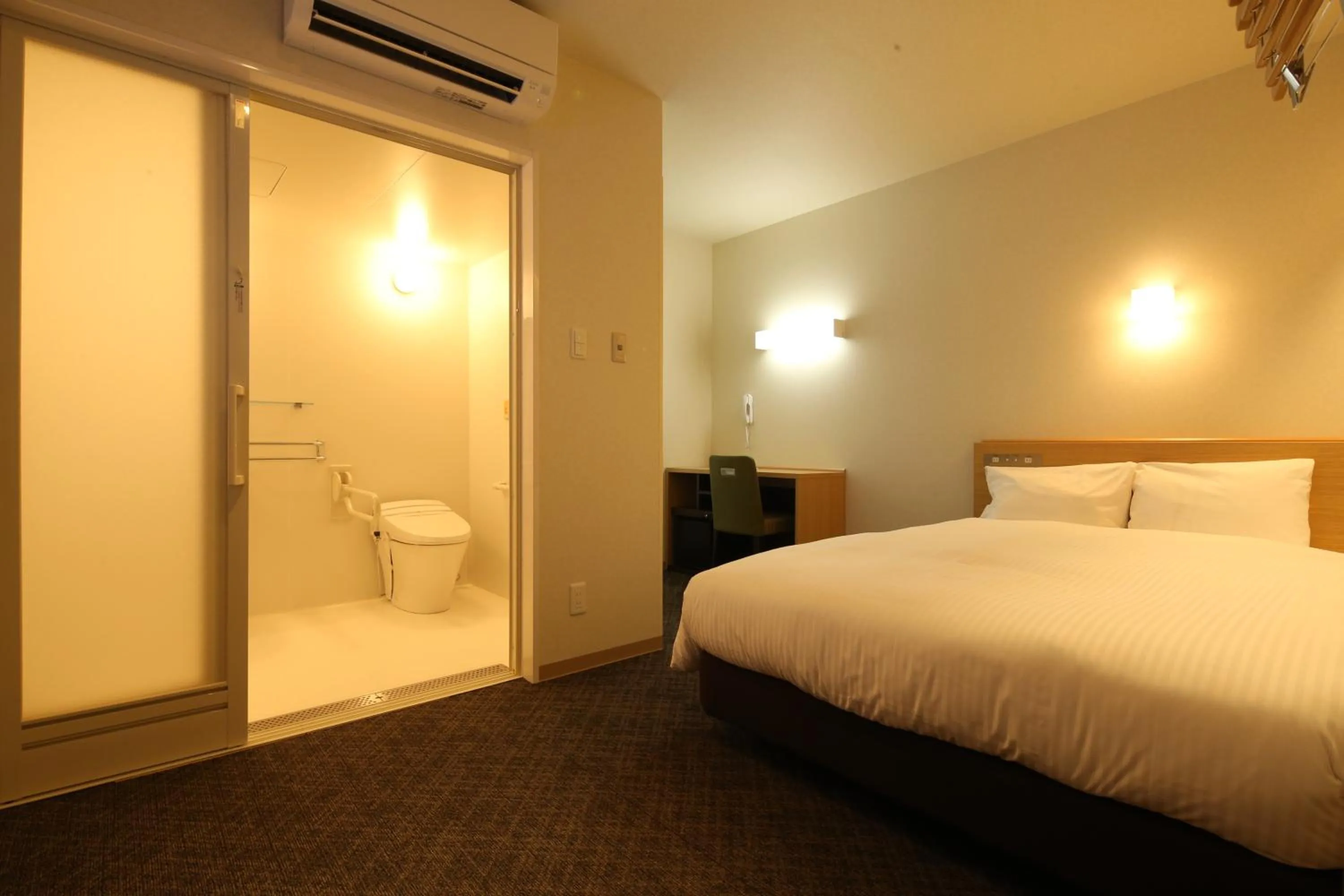 Bed in AB Hotel Sakaihigashi