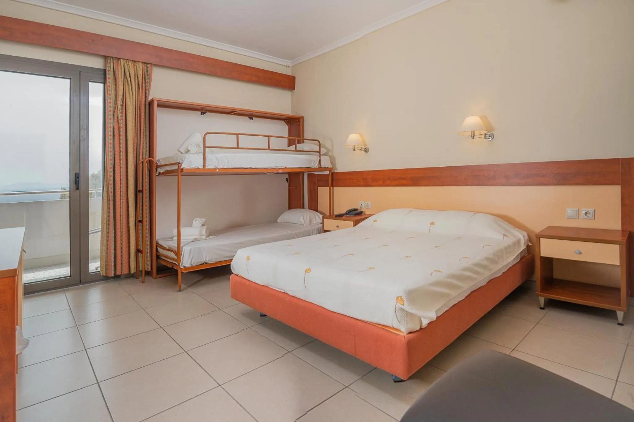 Bed in Marmari Bay Hotel