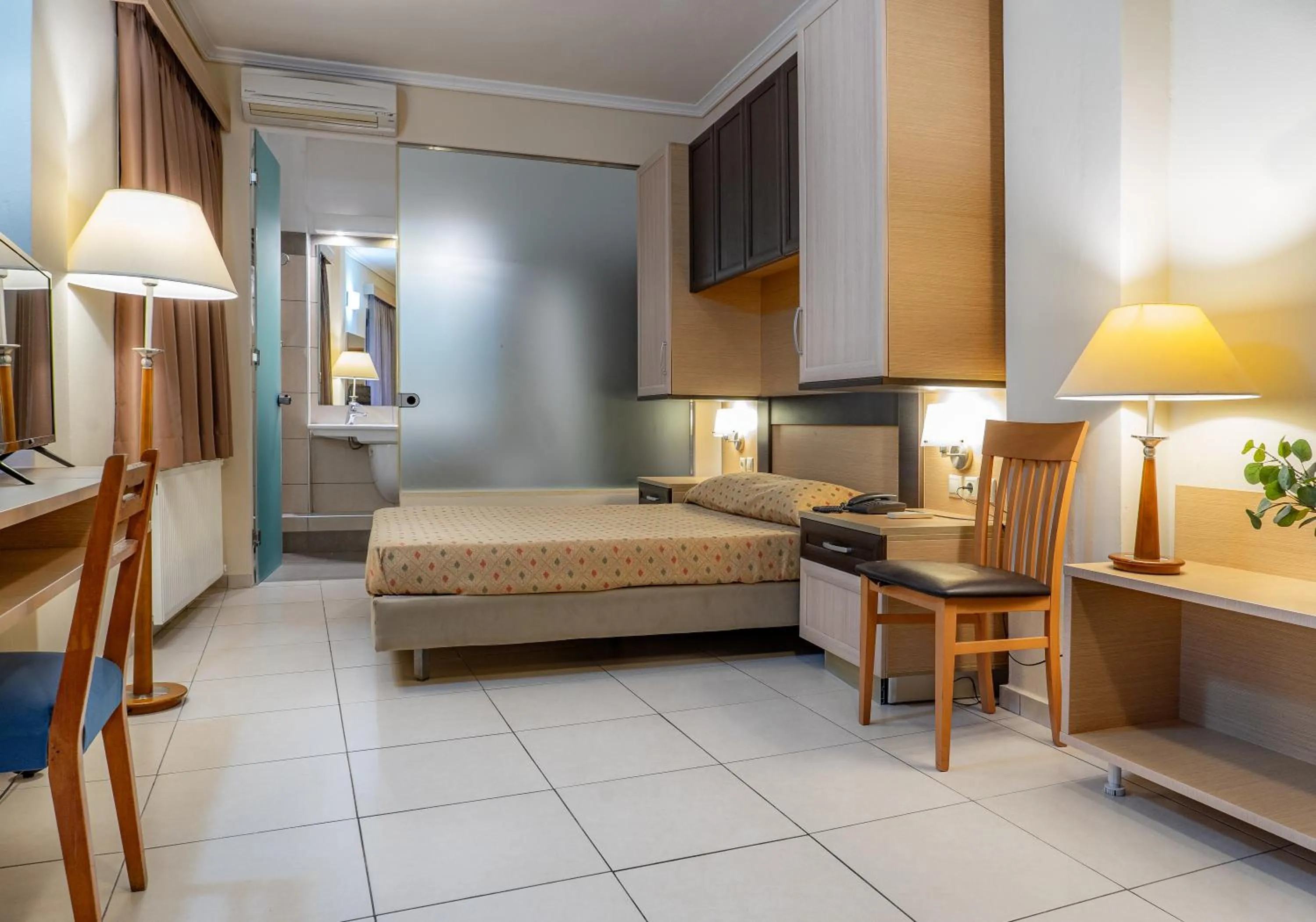 Bed in Marmari Bay Hotel