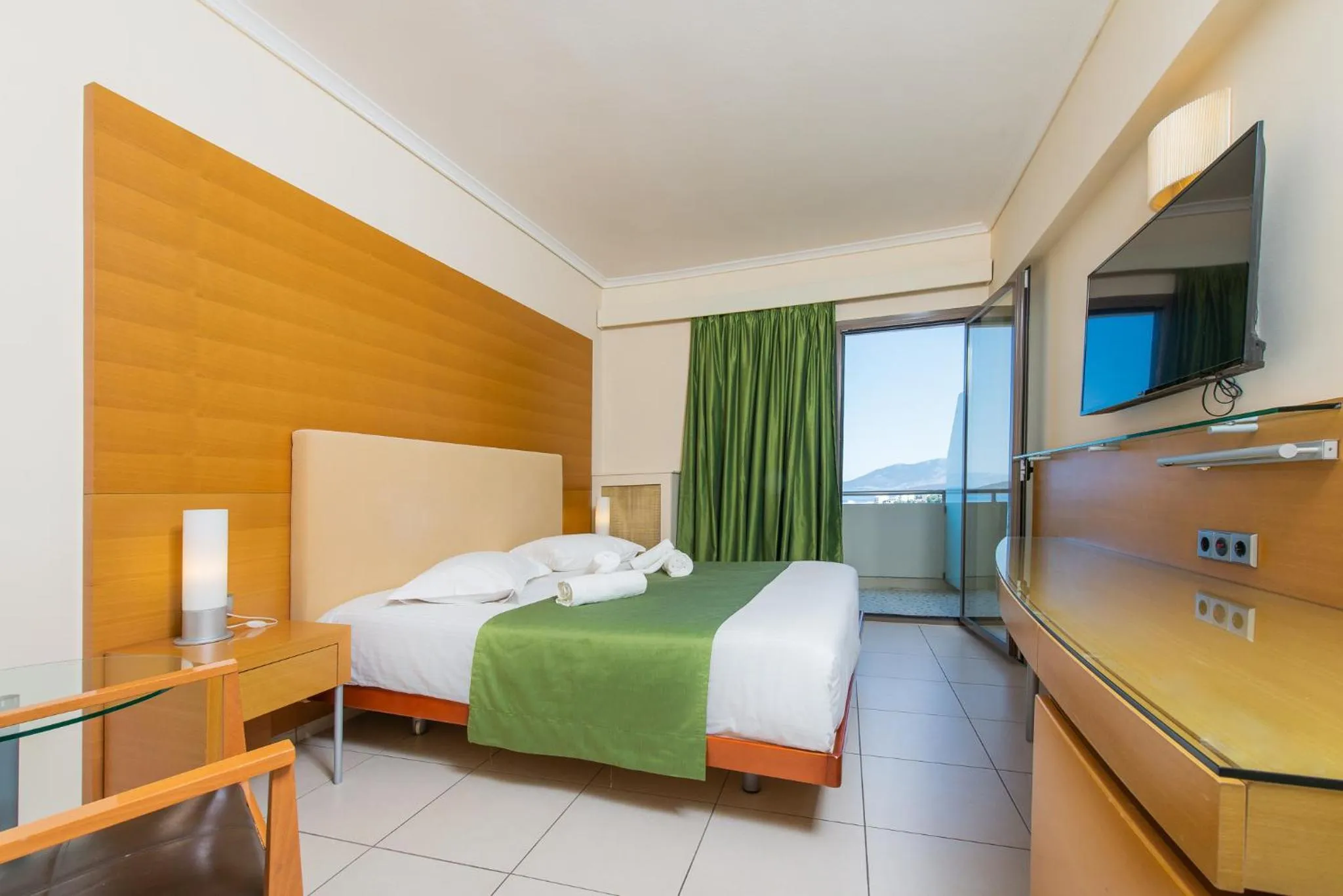 Bed in Marmari Bay Hotel