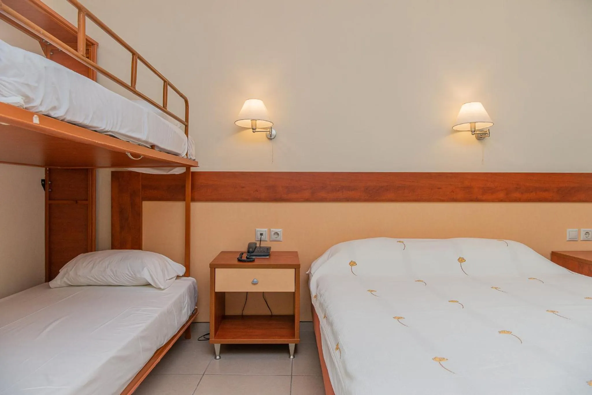 Bed in Marmari Bay Hotel