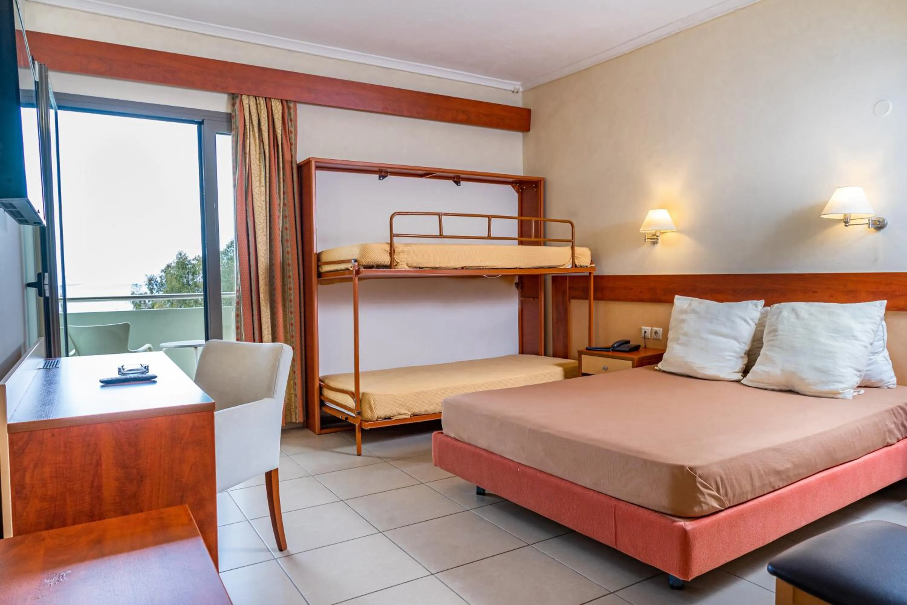 Bed in Marmari Bay Hotel