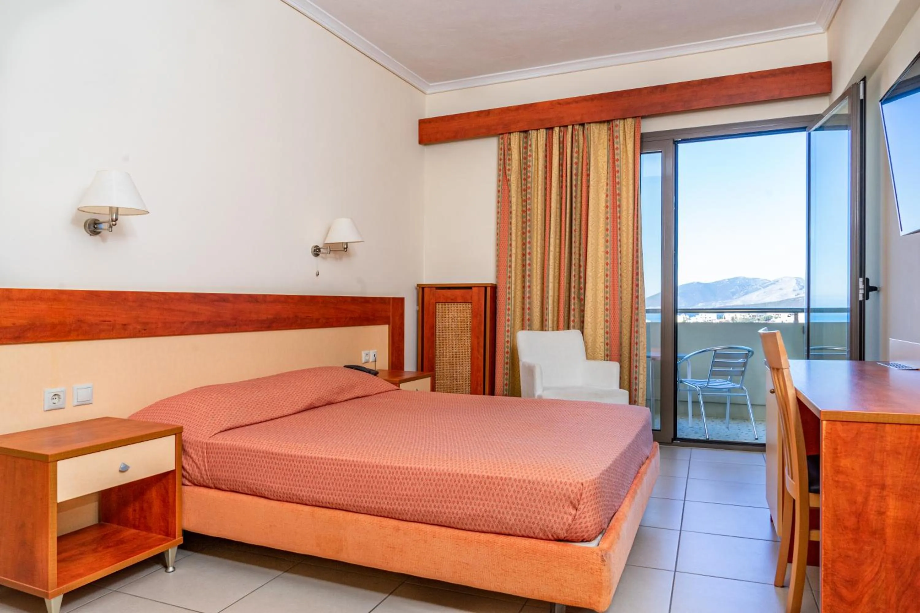 Bed in Marmari Bay Hotel