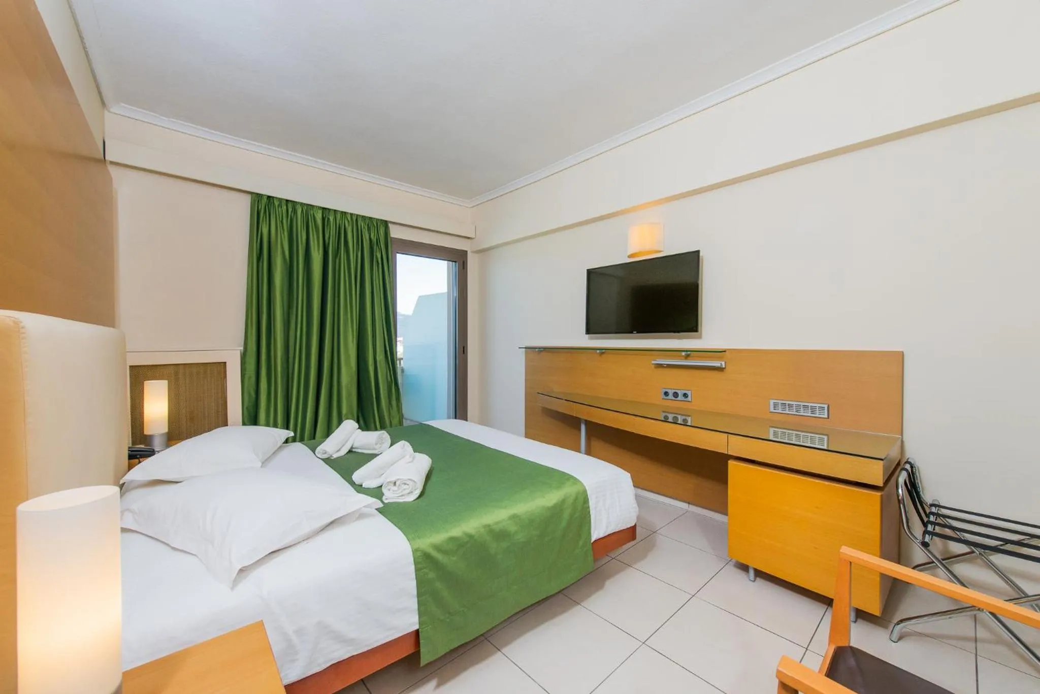 Bed in Marmari Bay Hotel