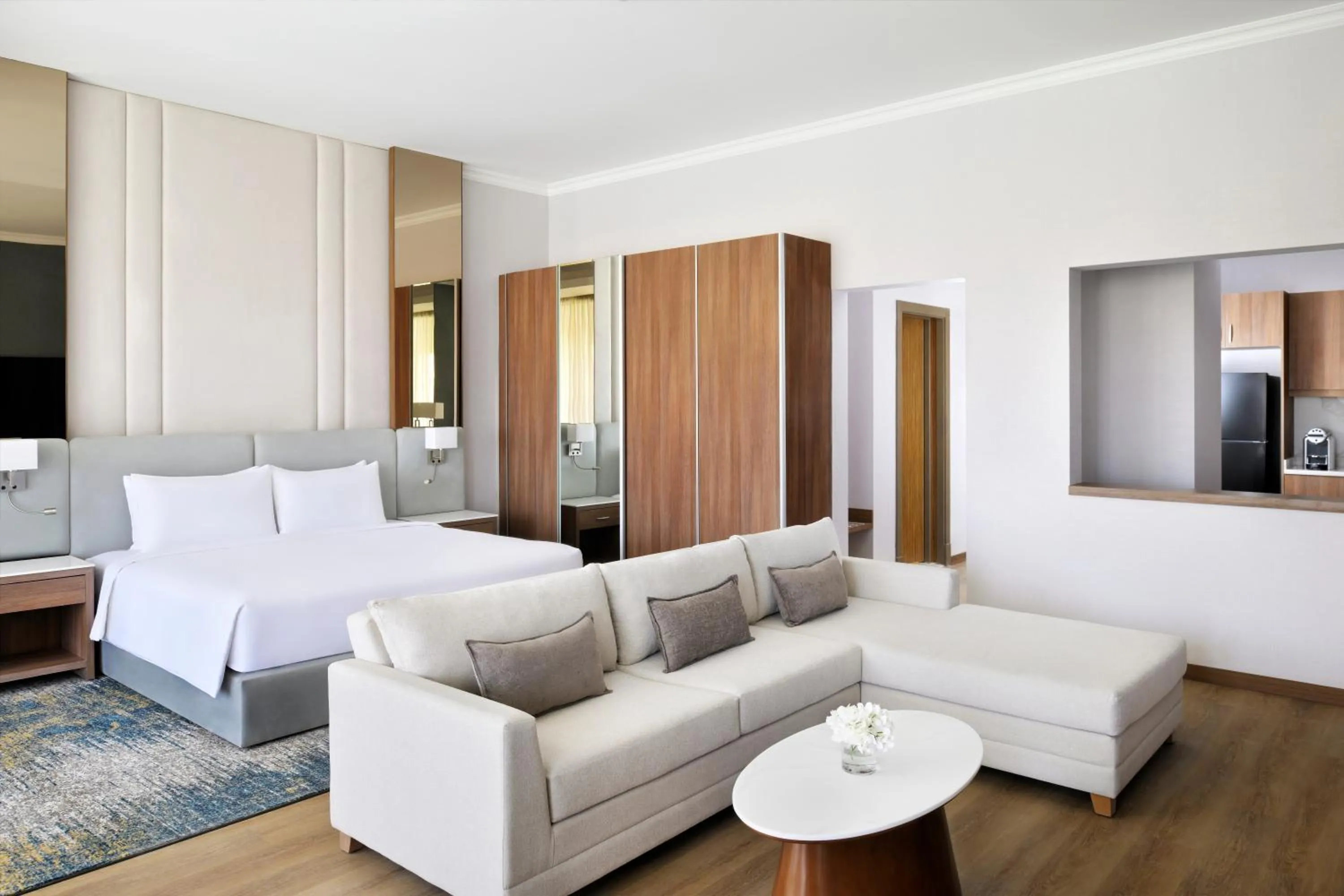 Kitchen or kitchenette, Bed in Mövenpick Hotel Waad Al Shamal