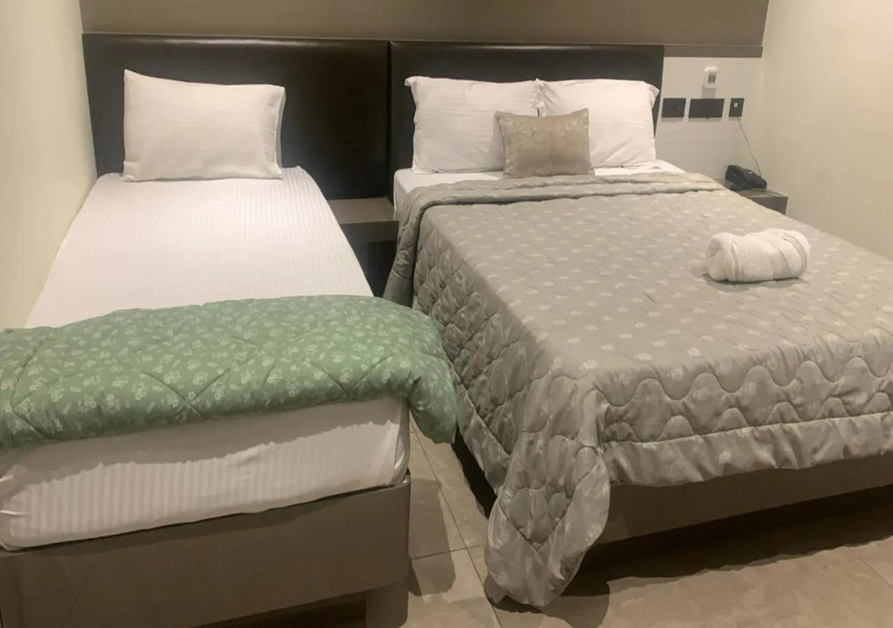 Photo of the whole room, Bed in MAS Residency