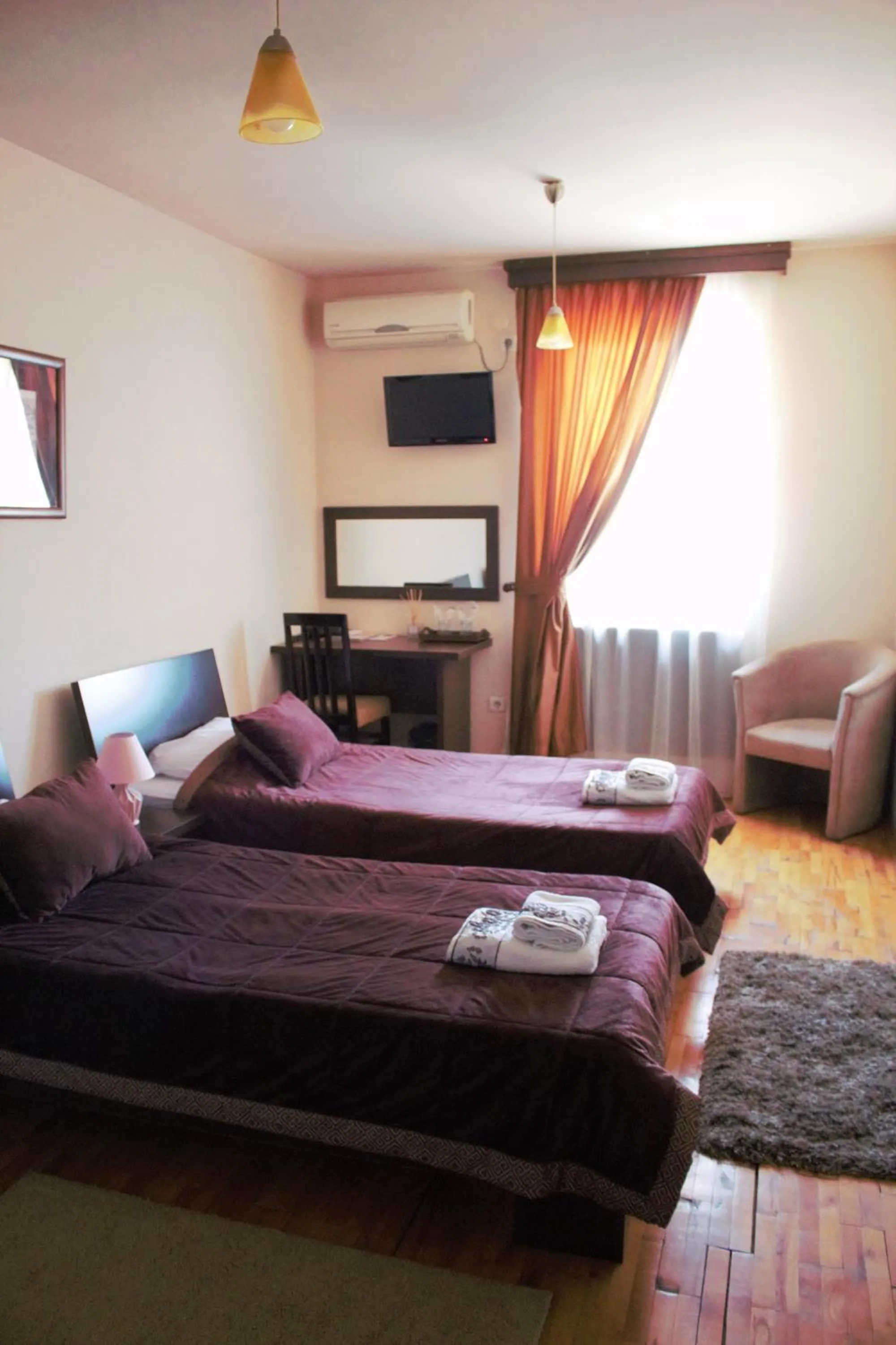 Bedroom in Garni Hotel City