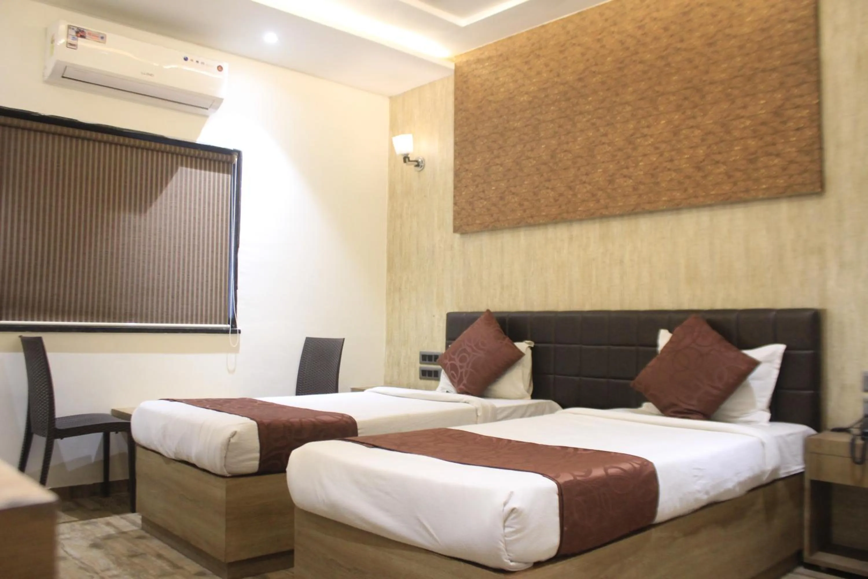 Bed in Hotel Sahyadri