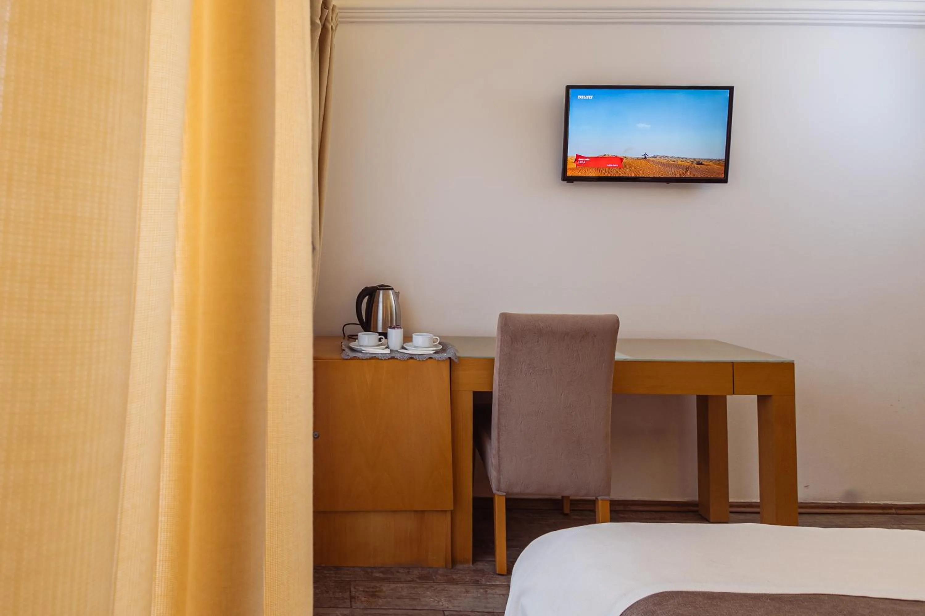 Seating area, Bed in MB City Hotel