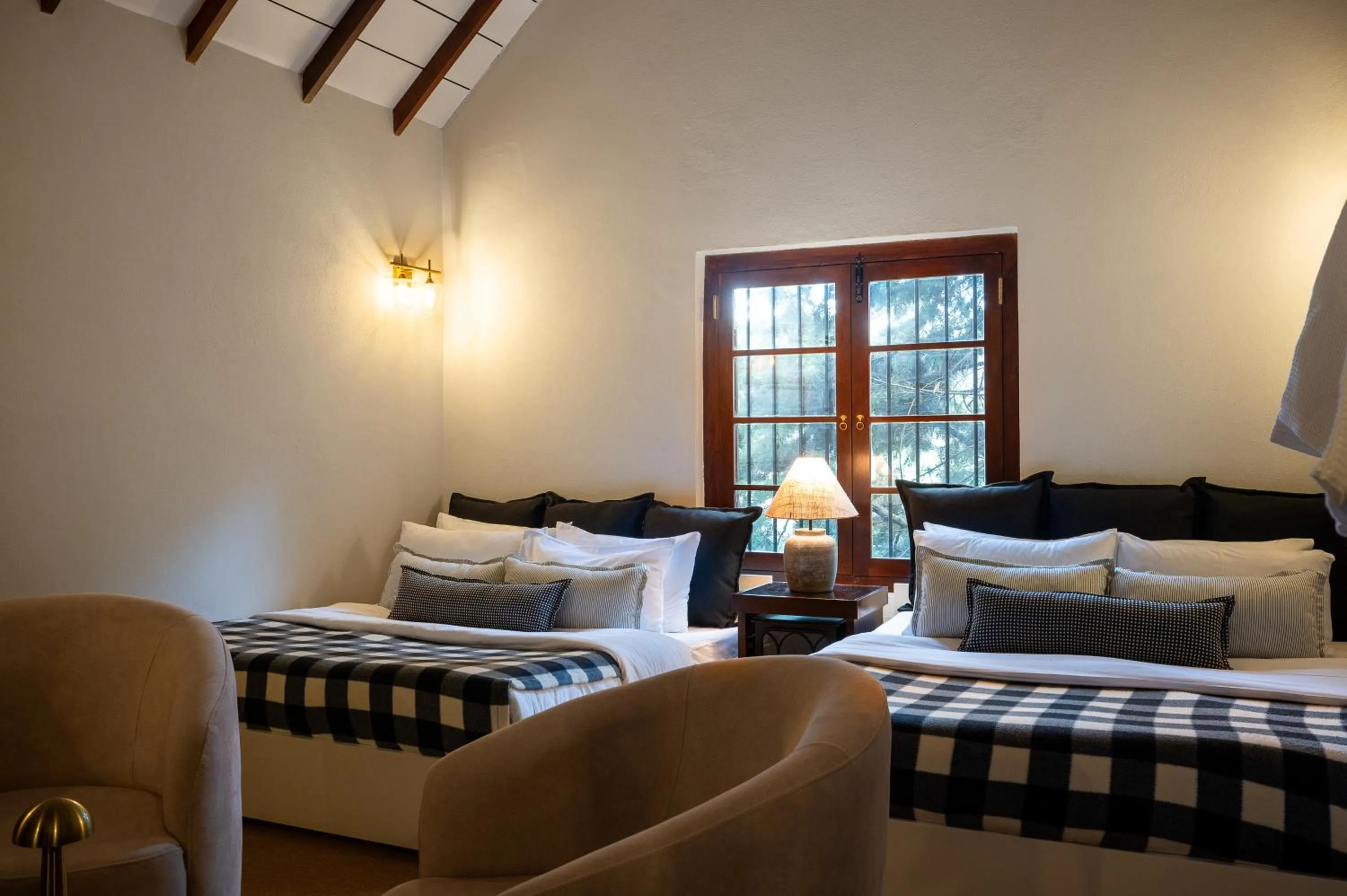 Seating area, Bed in Tathya Hills - Luxe Garden Retreat In The Hills