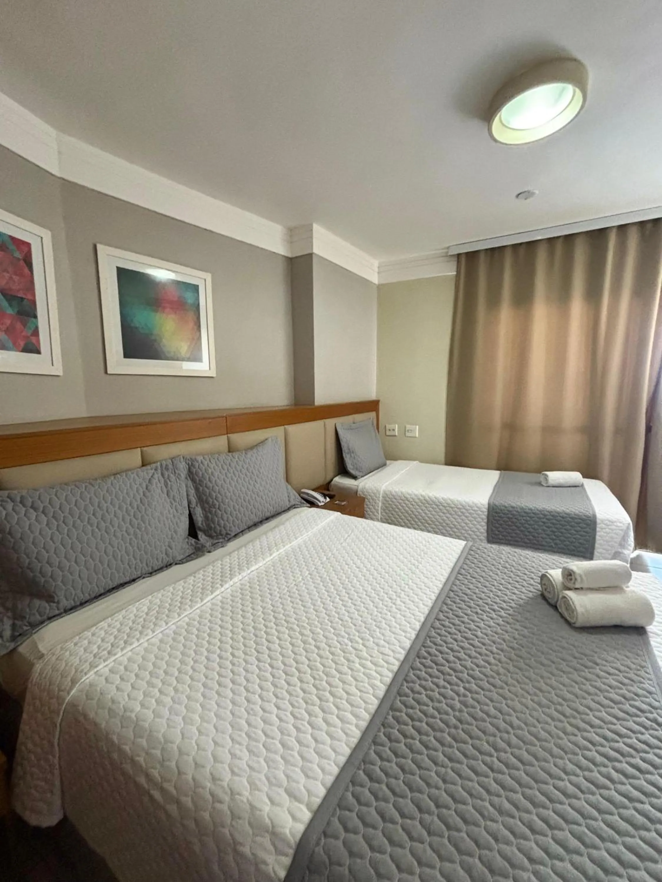 Bed in Royal Urban Macaé Hotel