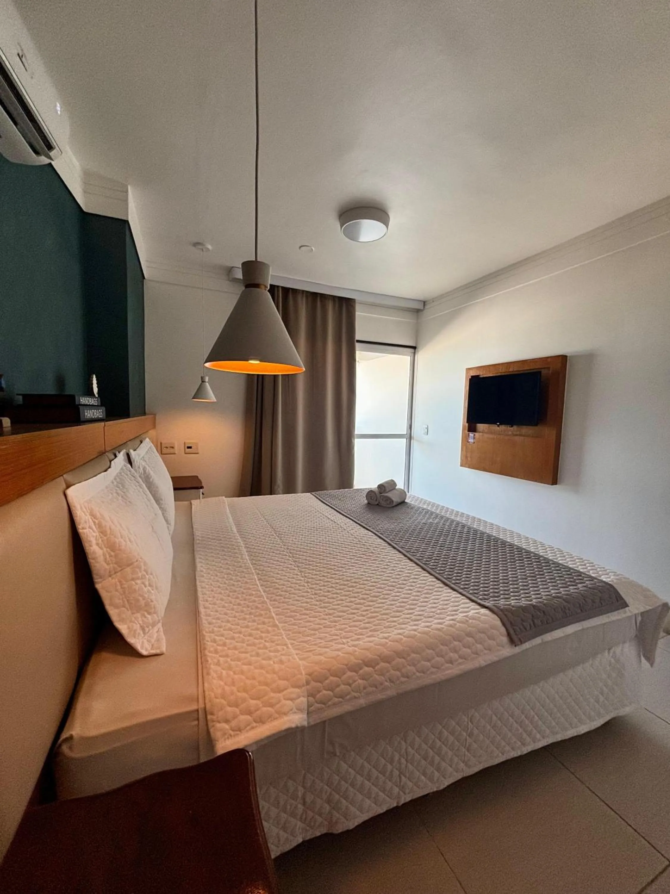 Bed in Royal Urban Macaé Hotel