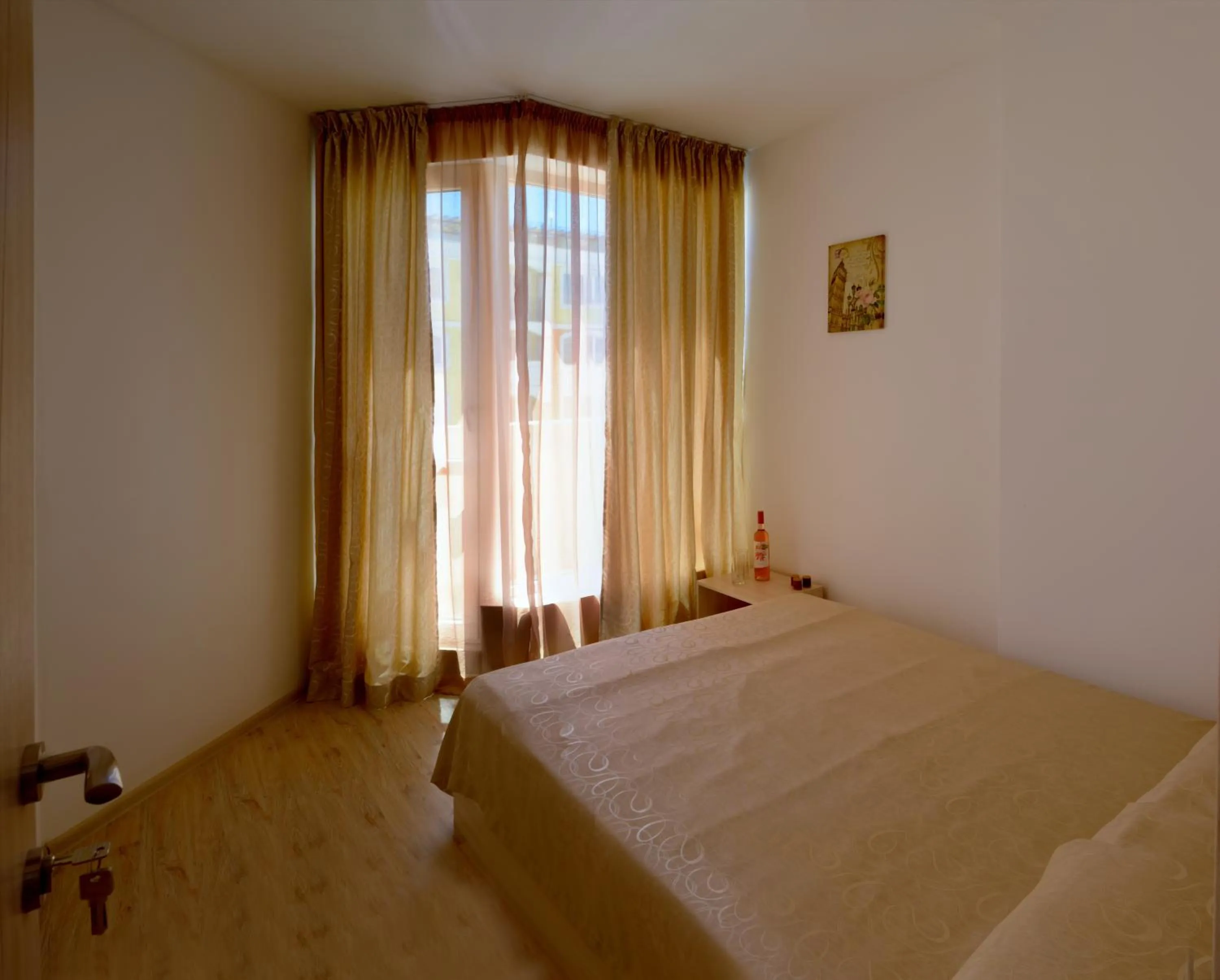 Bed in Vanilla Garden Apartments