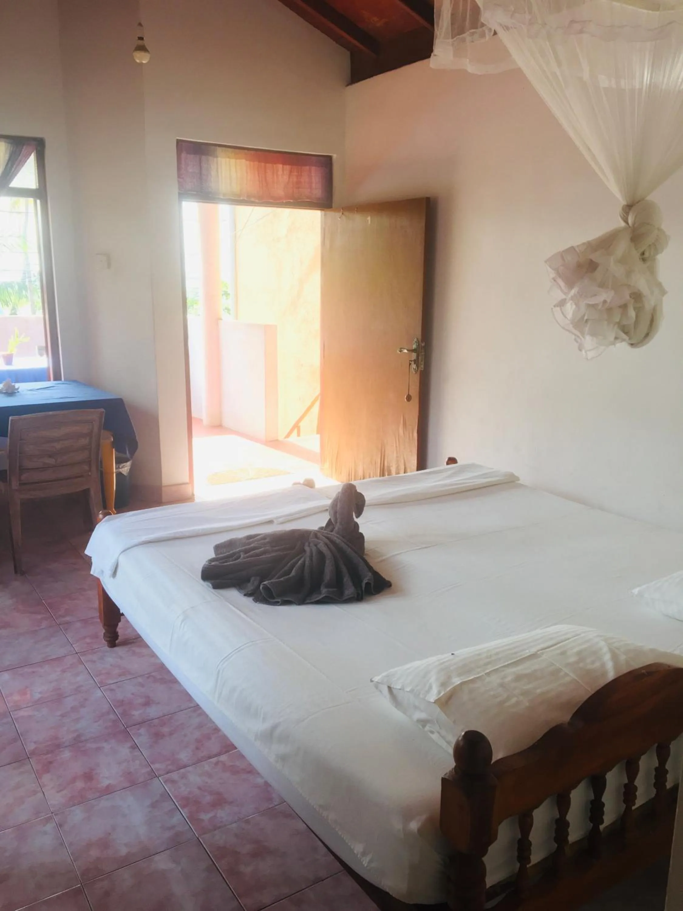 Bed in Dilena Beach Inn