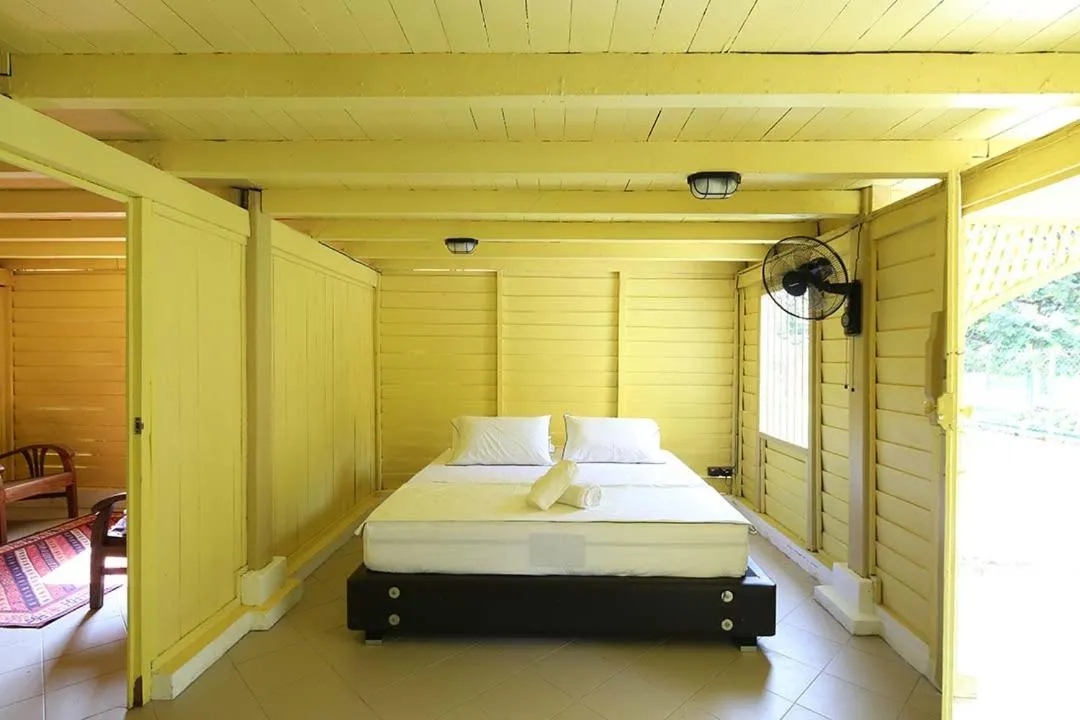 Bed in Bagas Zakariah Orchard Lodge