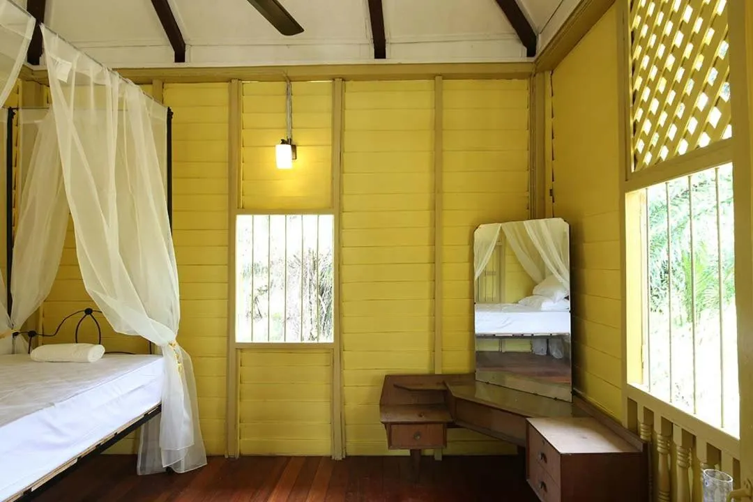 Bed in Bagas Zakariah Orchard Lodge