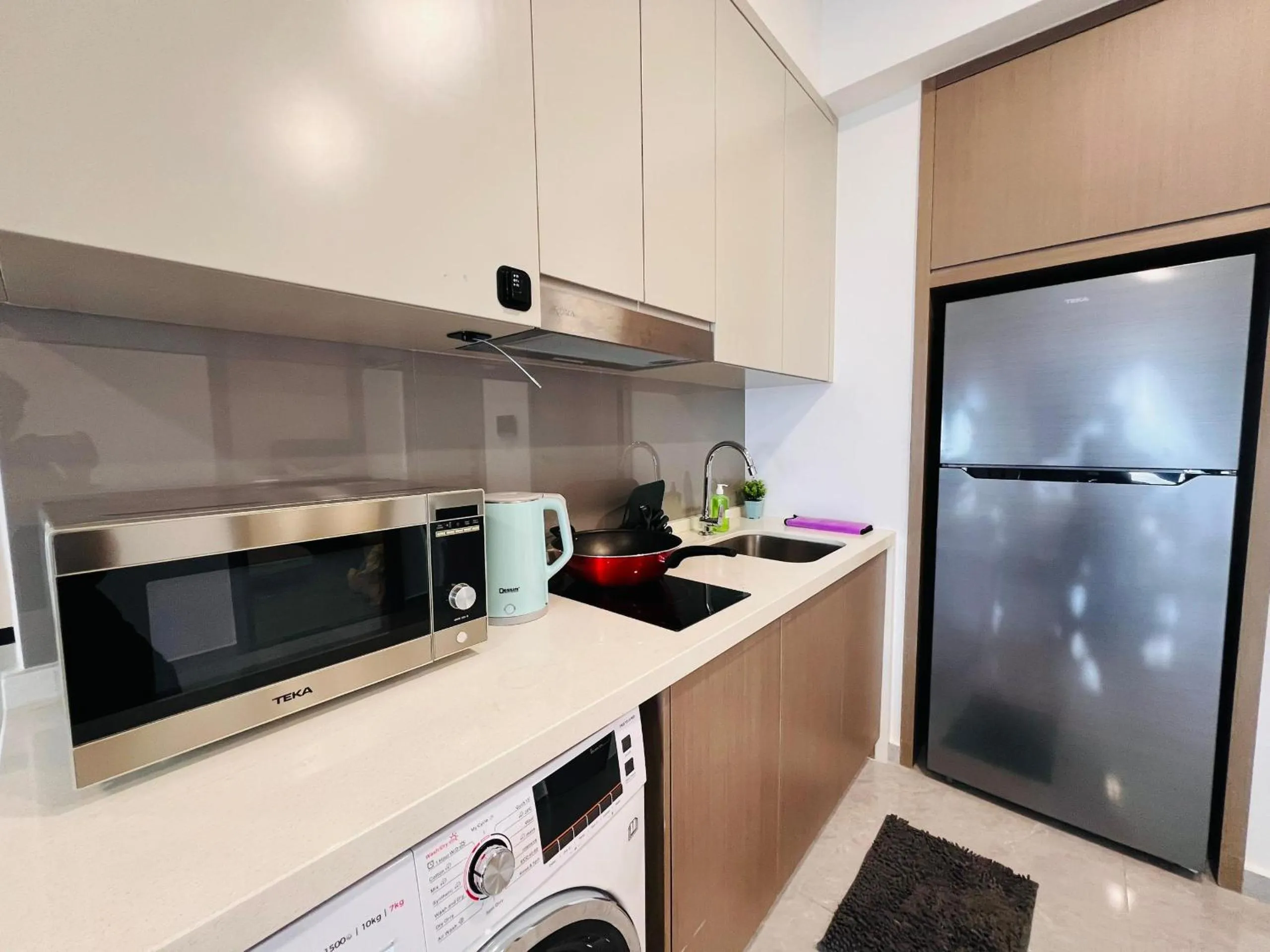Kitchen or kitchenette in Agile Bukit Bintang by DeUrban