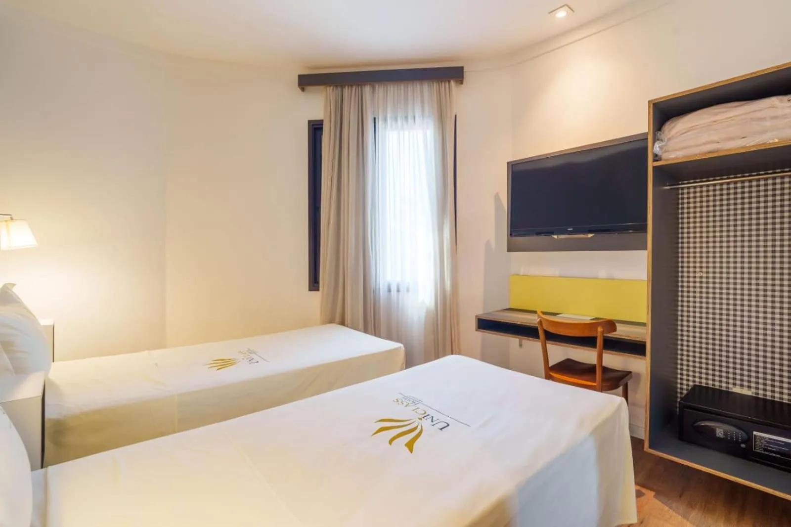 Bed in Uniclass Hotel Pinheiros