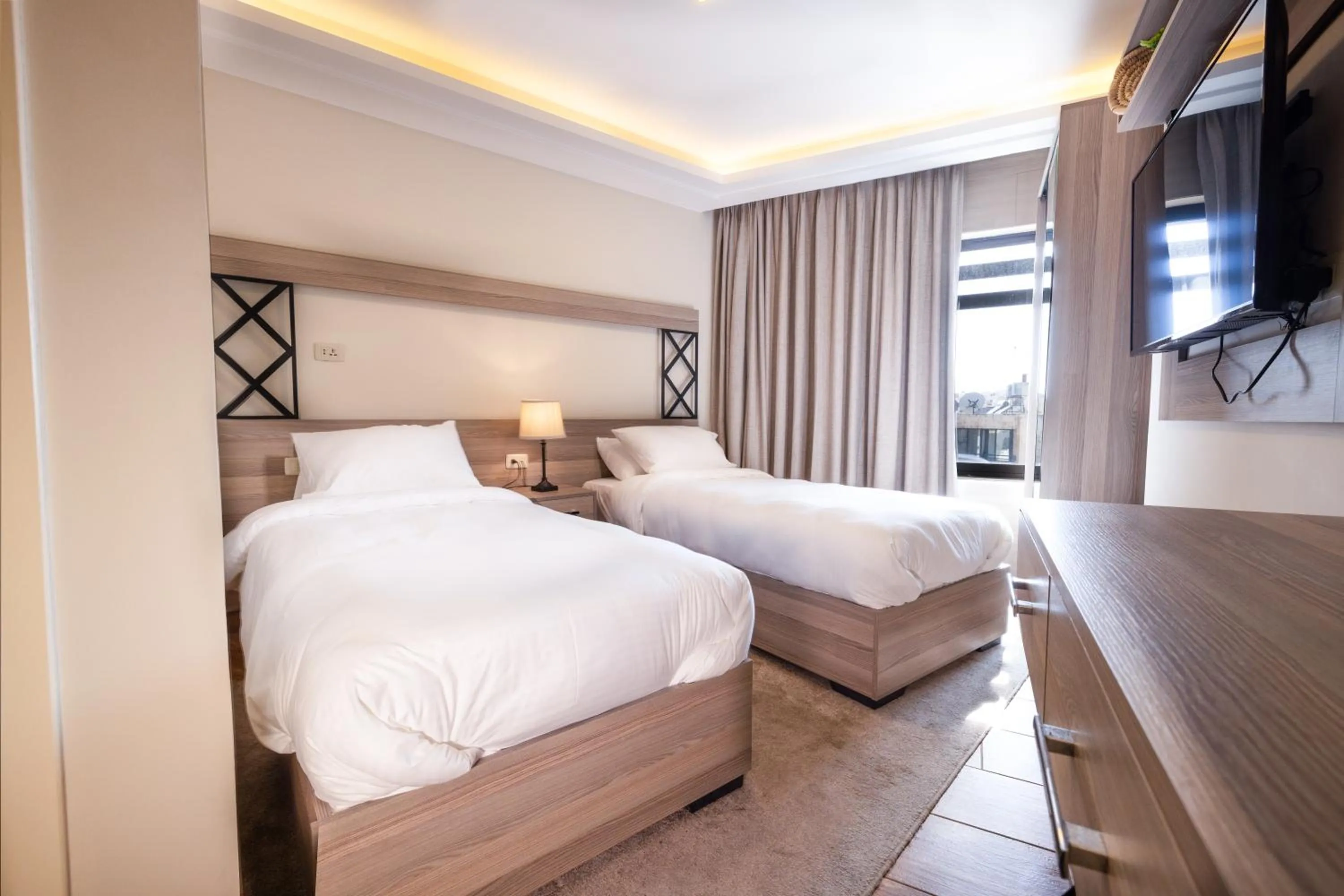 Bed in Sukoon Hotel Amman