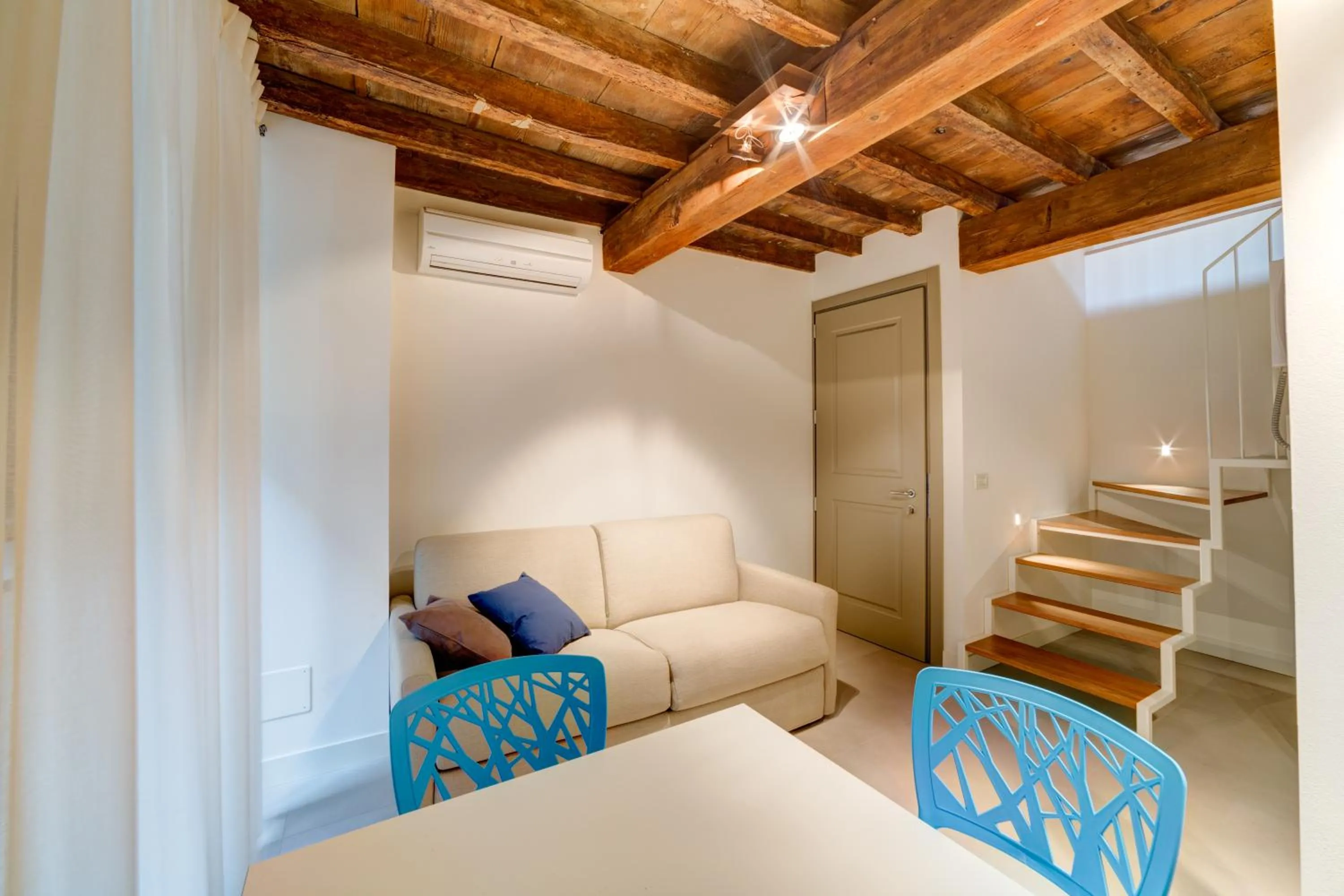 Living room, Bed in Palazzo Mannaioni Suites