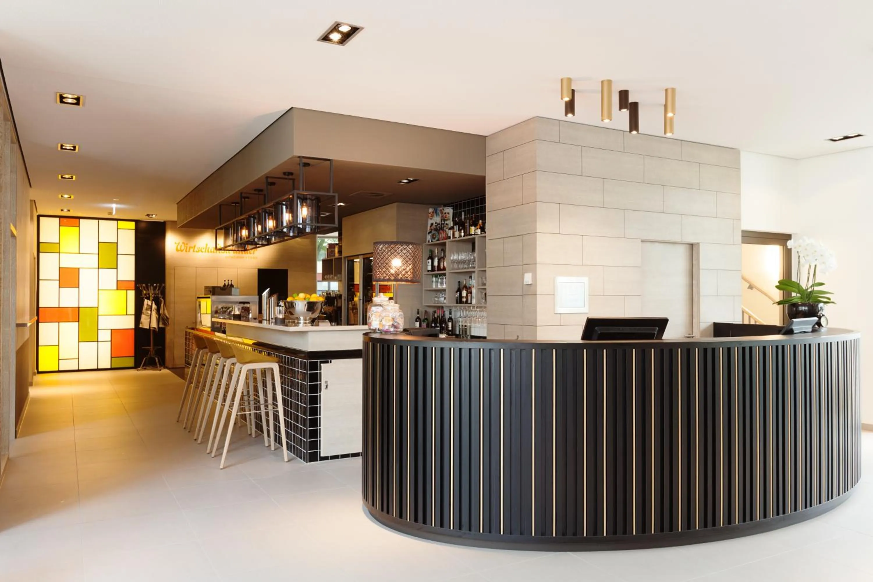 Lobby or reception in Vienna House Easy by Wyndham Osnabrück City & Apartments