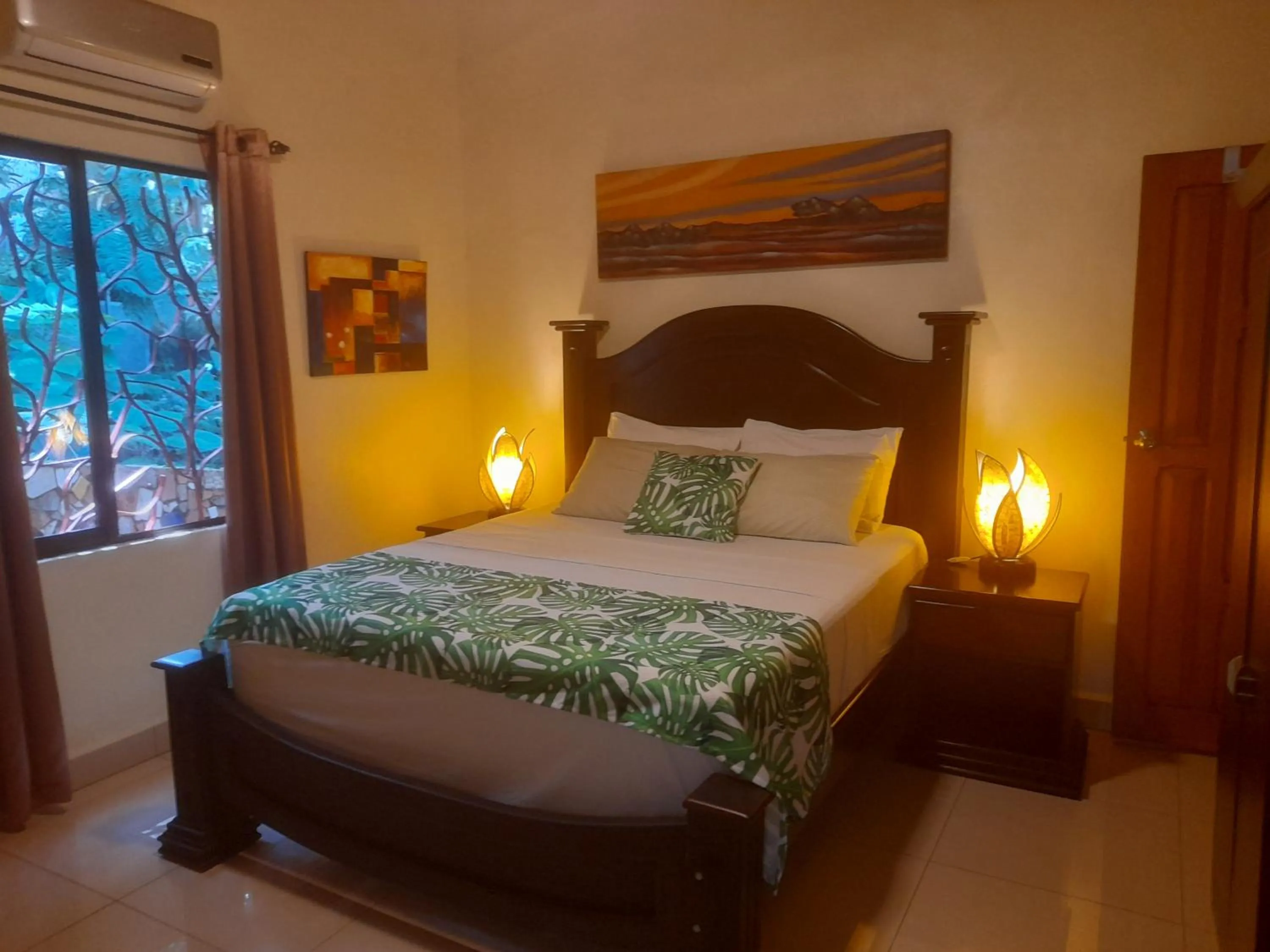 Bed in Coyaba Tropical Elegant Adult Guesthouse