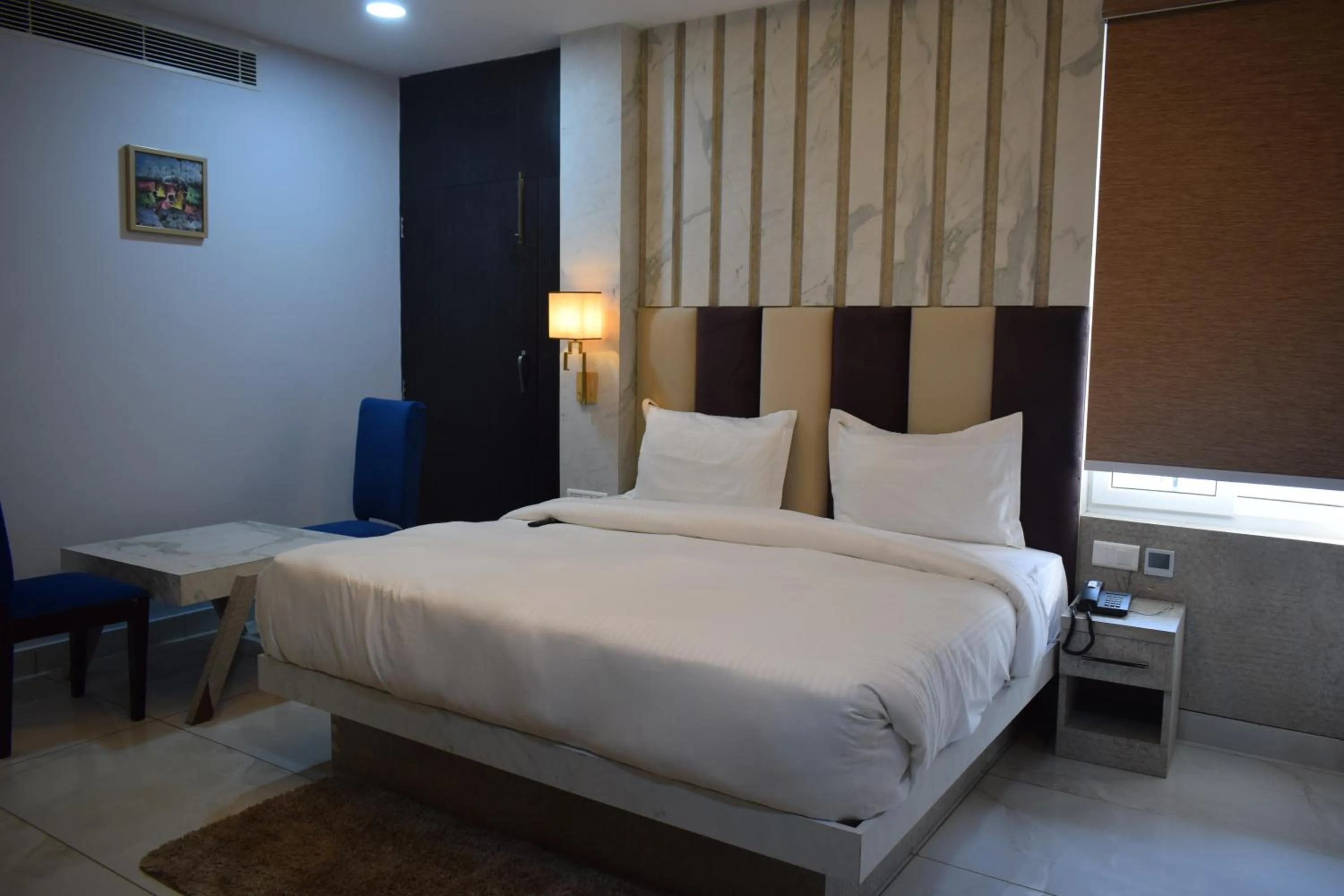 Bedroom, Bed in Country Ambience Hotel By Jags City Mall