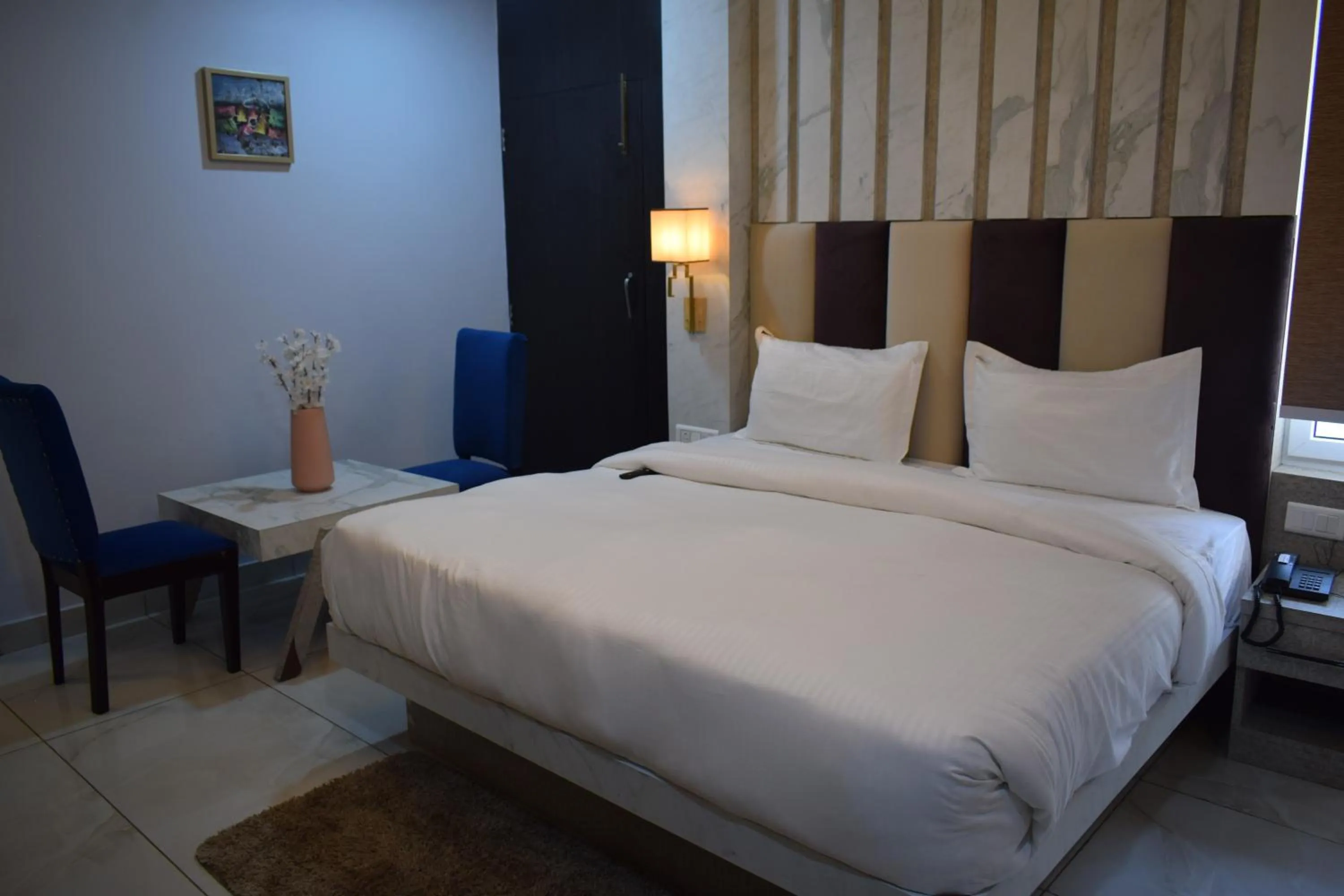 Bedroom, Bed in Country Ambience Hotel By Jags City Mall