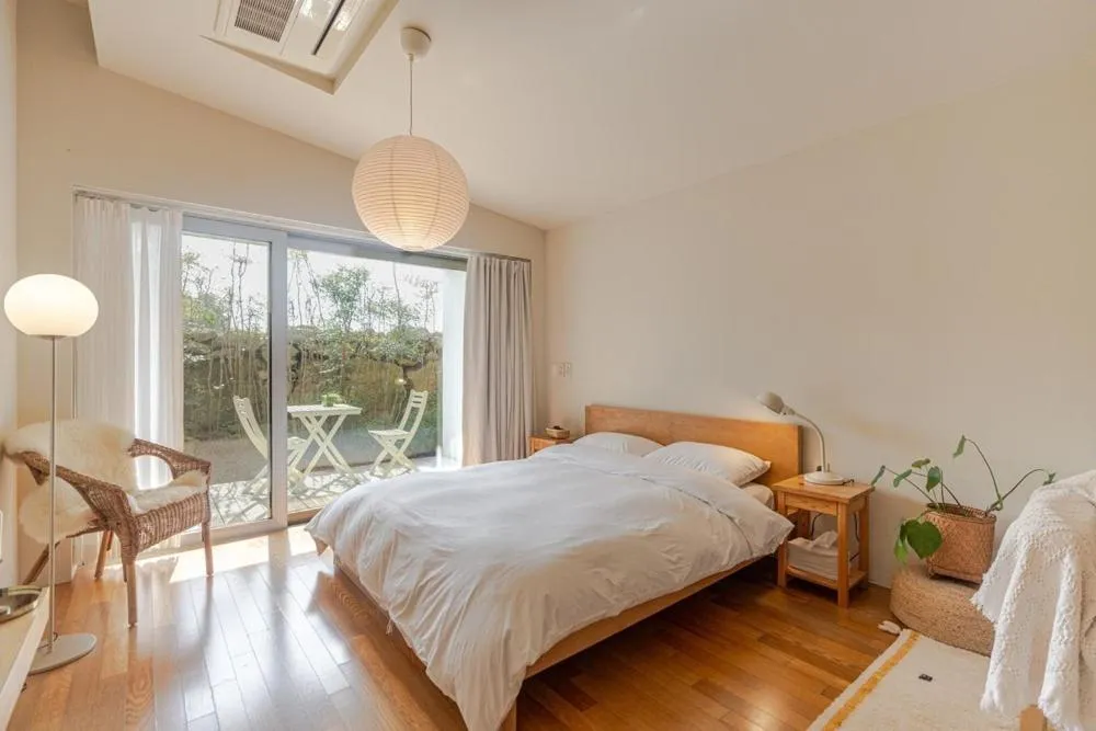 Bed in Jeju Mooi Pension