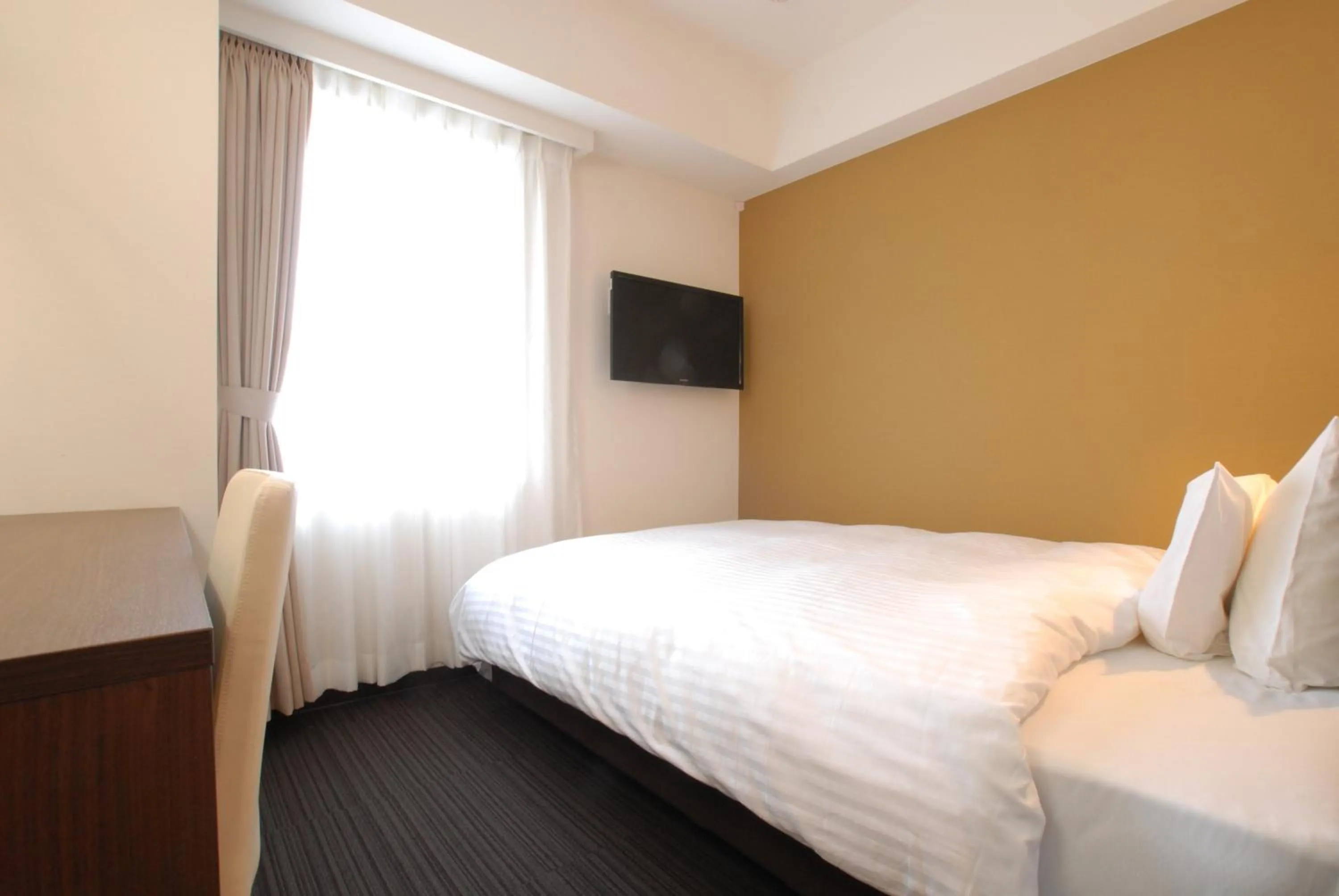 Bed in AB Hotel Kanazawa