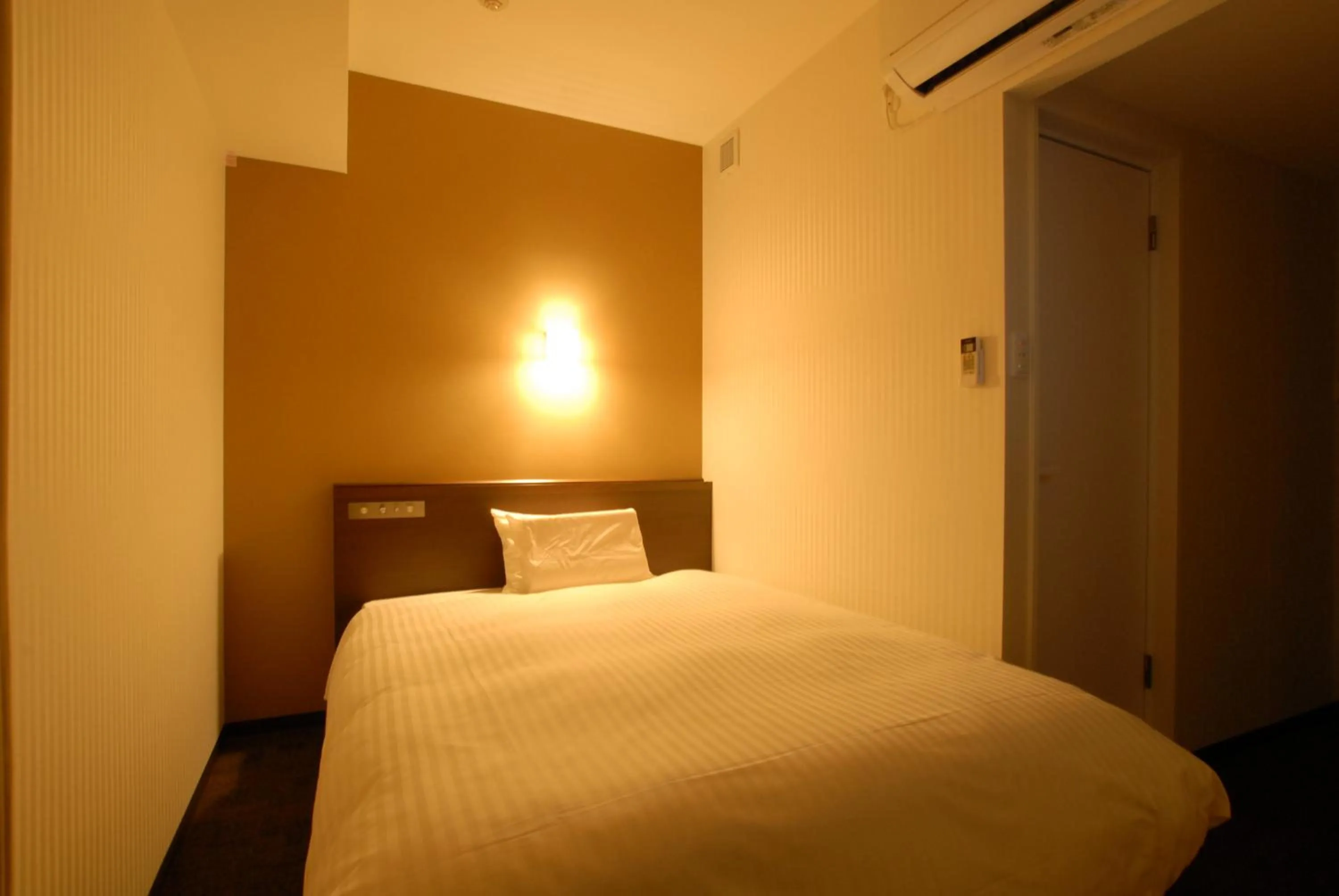 Bed in AB Hotel Kanazawa