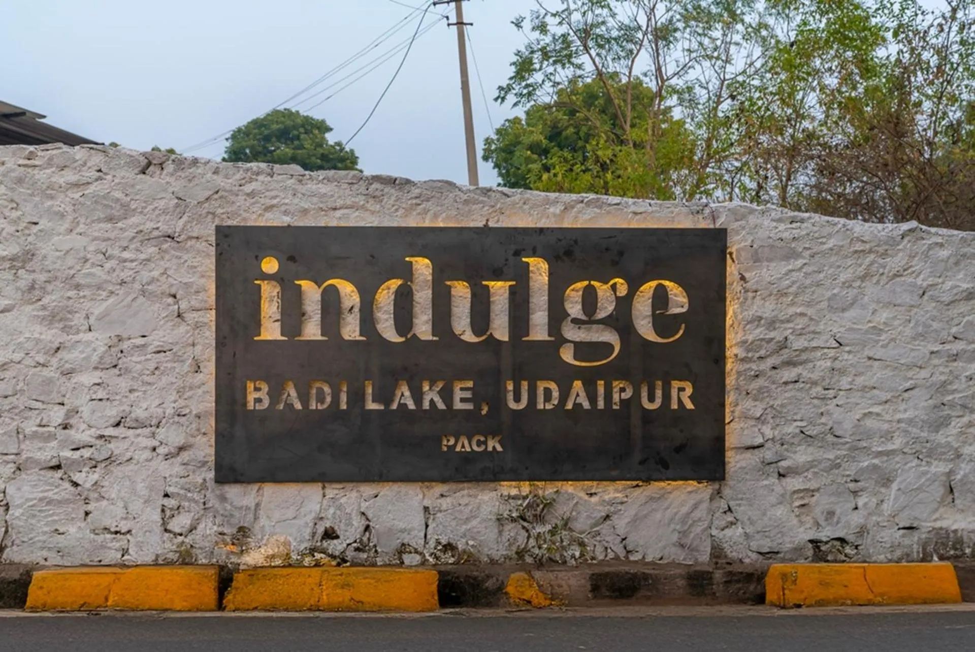 Property logo or sign in Indulge Udaipur by Pack