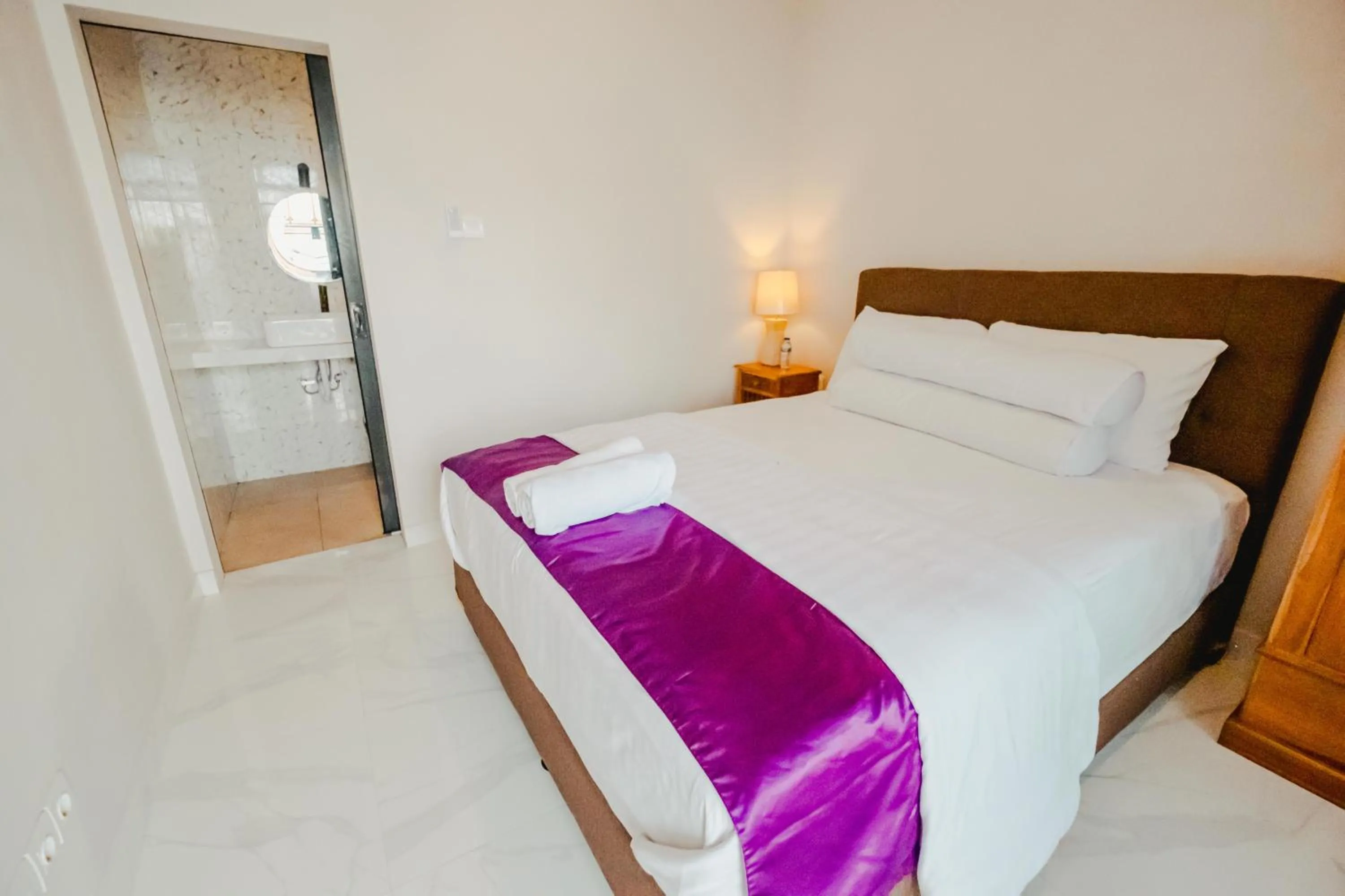 Bed in Turtle Shelter Guest House