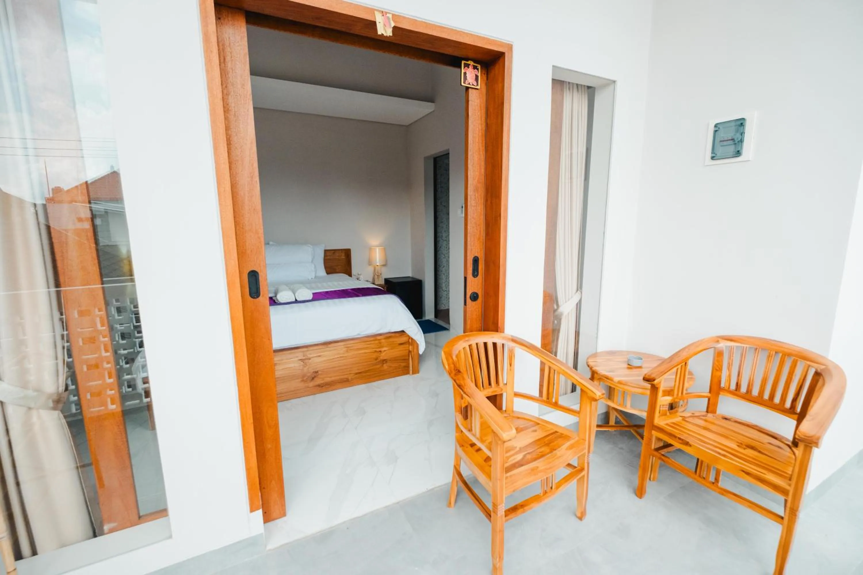 Seating area, Bed in Turtle Shelter Guest House