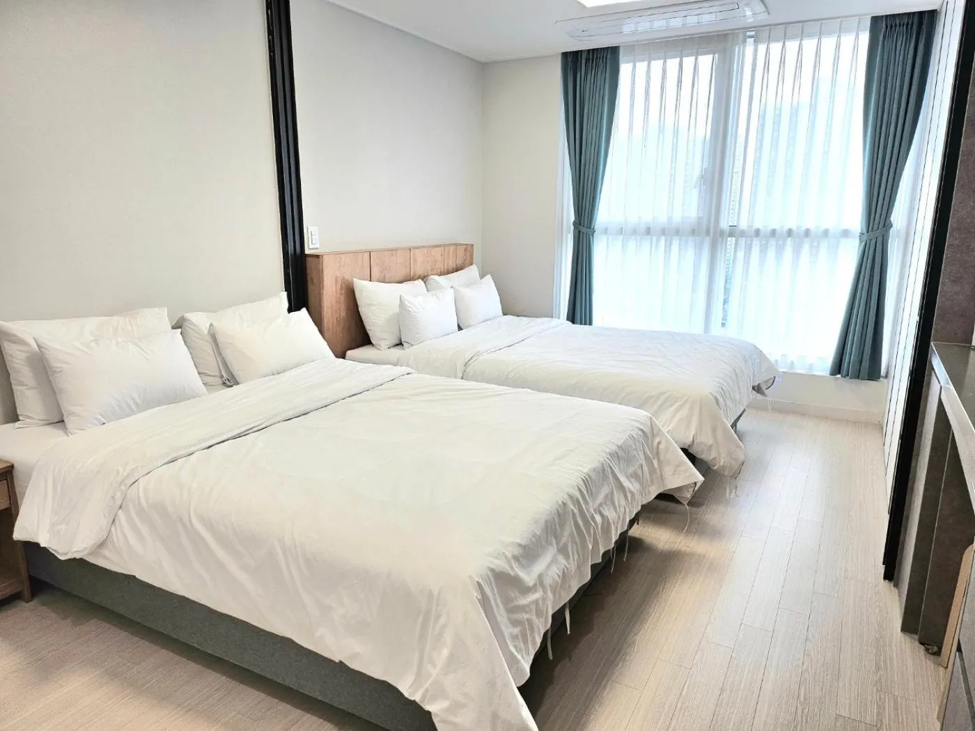 Bed in Grand Bleu Hotel & Residence