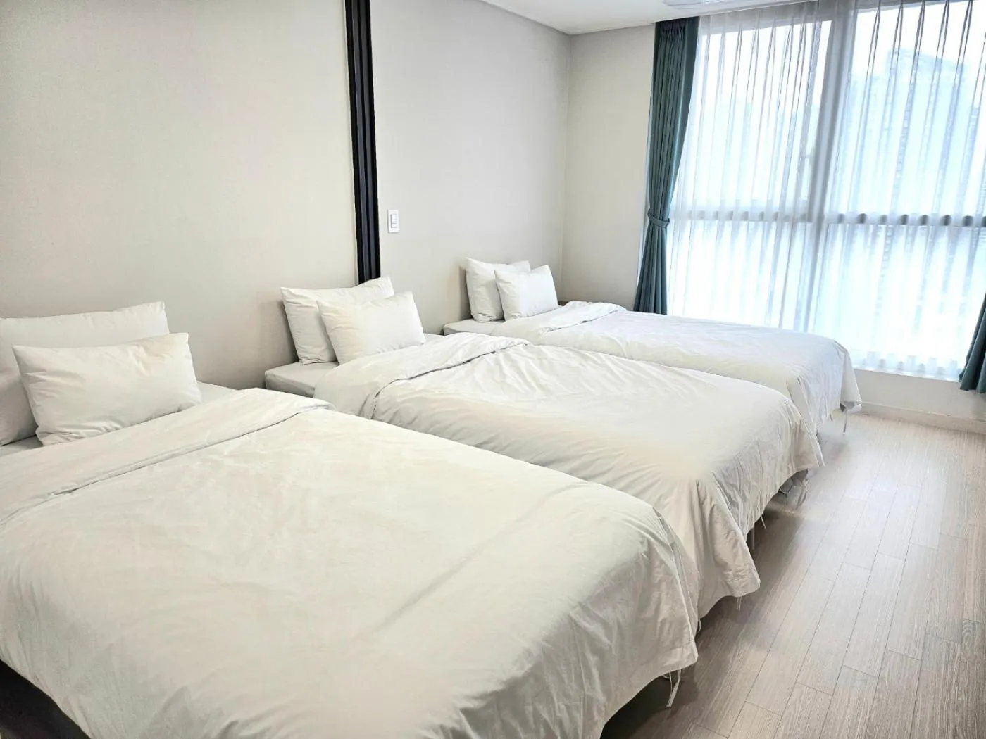 Bed in Grand Bleu Hotel & Residence