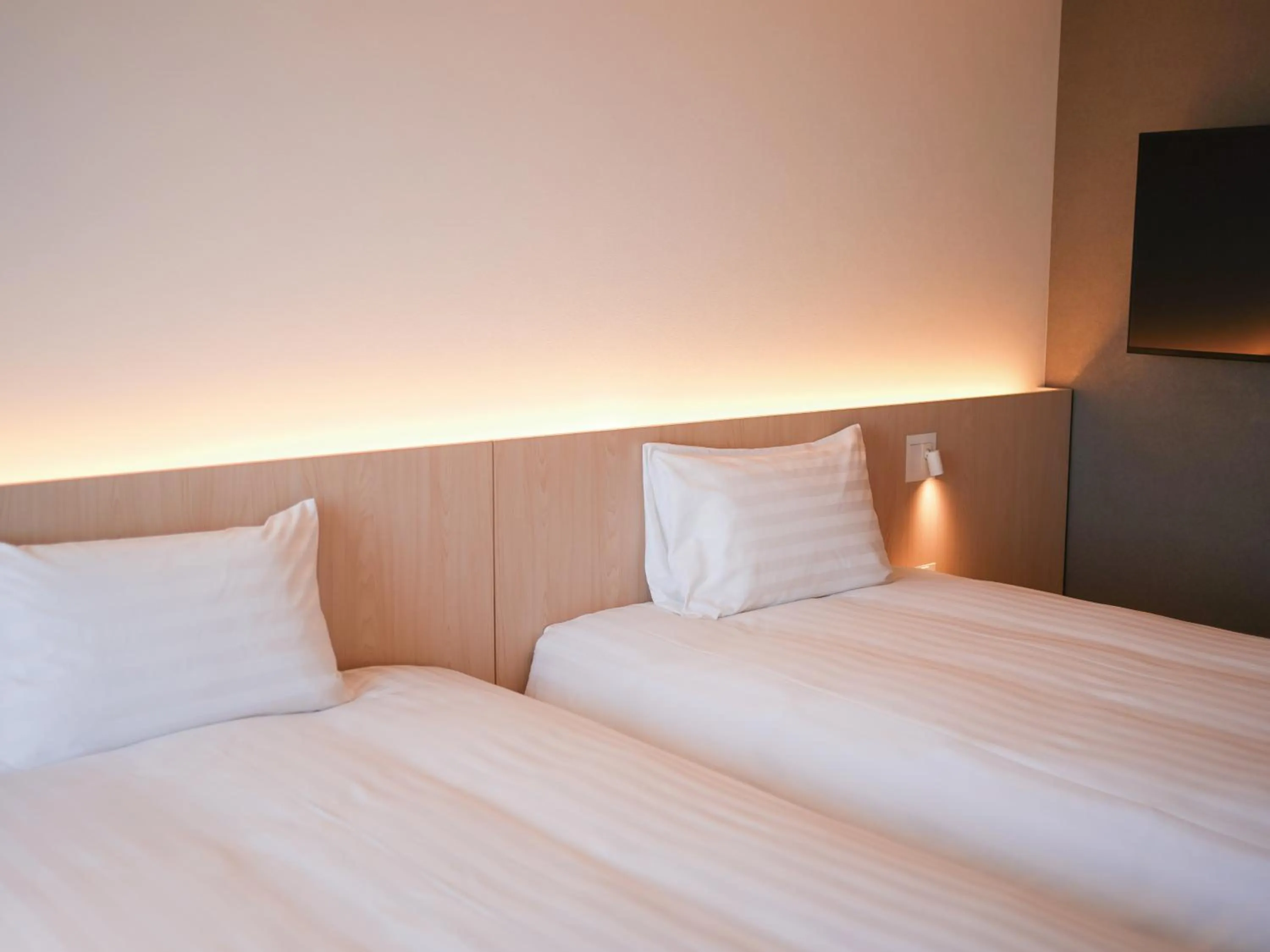 Bed in Dorsett by Agora Osaka Sakai