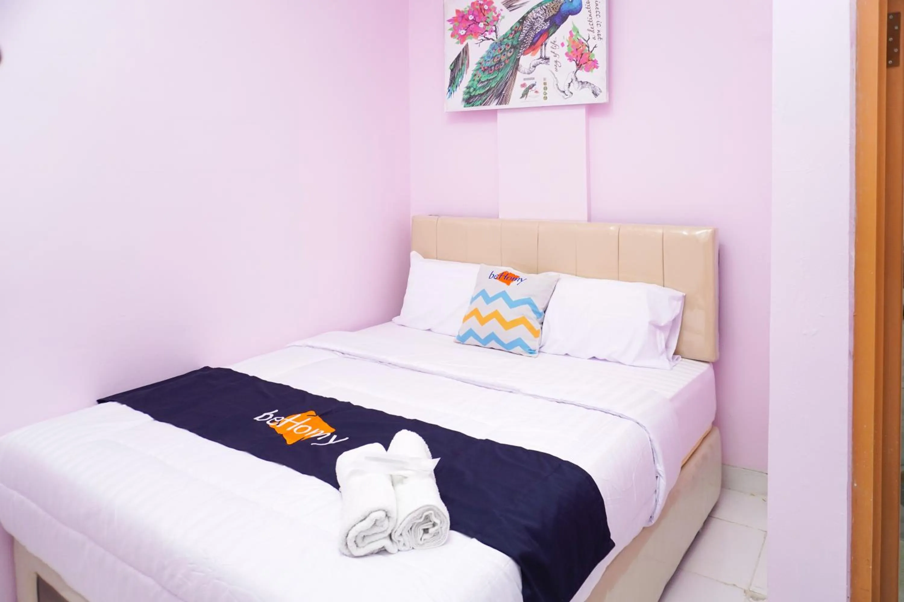 Bed in Behomy Cibinong Suite